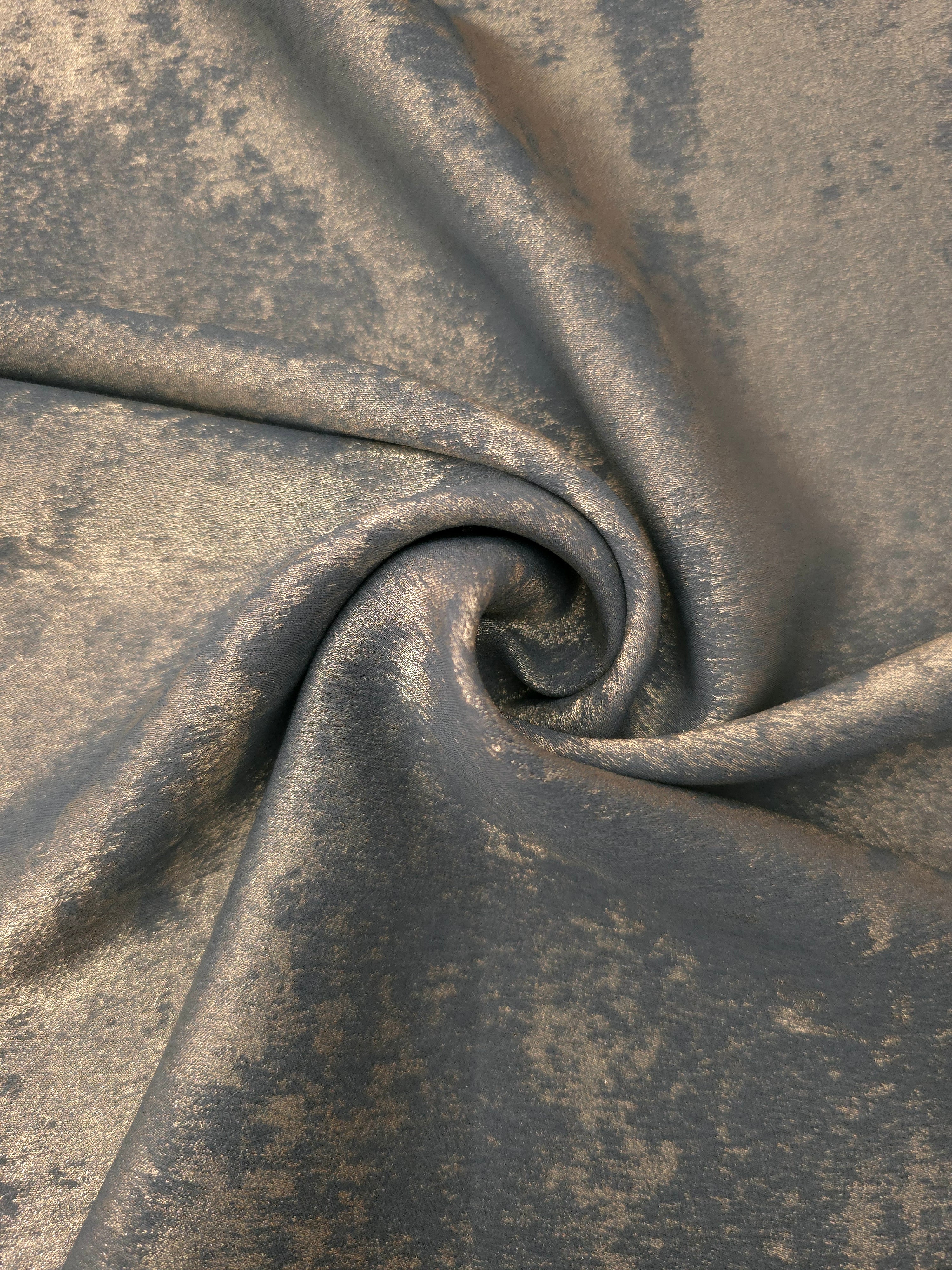 Pewter Bronze Lurex Italiano metallic fabric in a rosette drape with rich shimmer