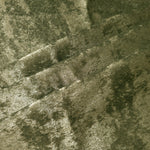 Pewter Olive Lurex Italiano fabric in diagonal folds showing metallic sheen and drape for eveningwear.