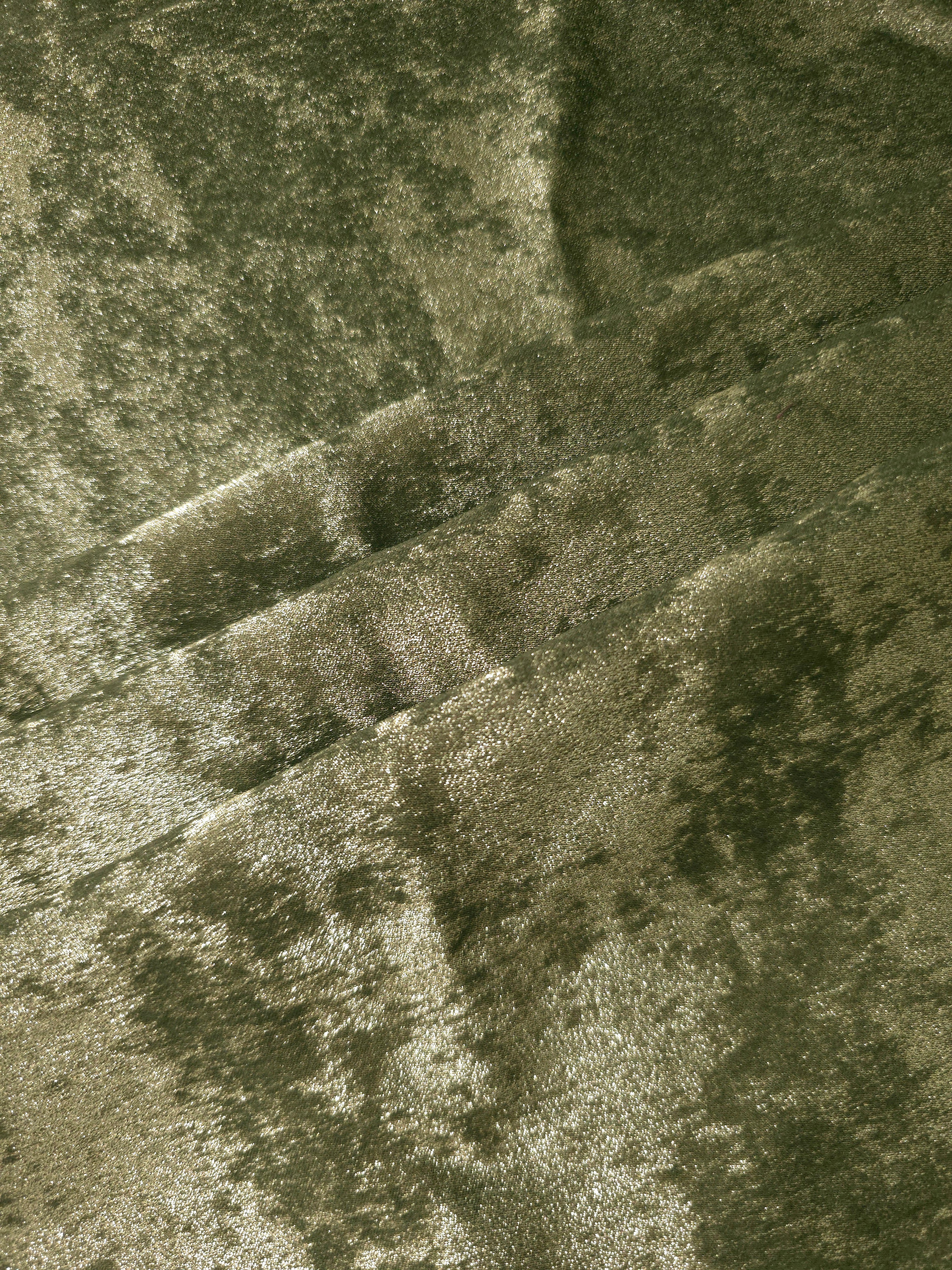 Pewter Olive Lurex Italiano fabric in diagonal folds showing metallic sheen and drape for eveningwear.