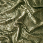 Flowing folds of Pewter Olive Lurex Italiano fabric highlighting drape for abayas, kaftans and dresses.