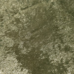 Macro close-up of Pewter Olive Lurex Italiano fabric revealing metallic texture for designer apparel.