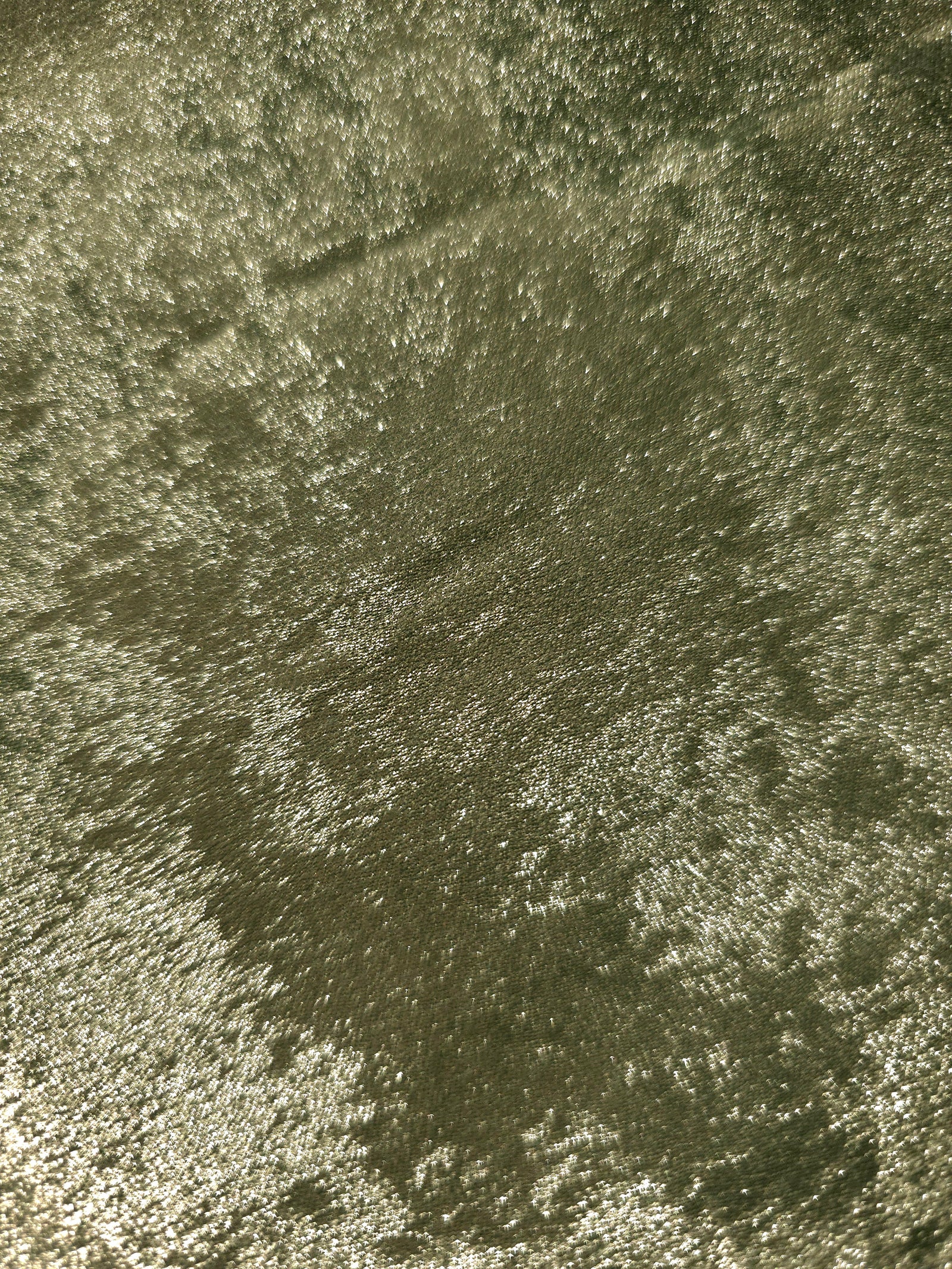 Macro close-up of Pewter Olive Lurex Italiano fabric revealing metallic texture for designer apparel.