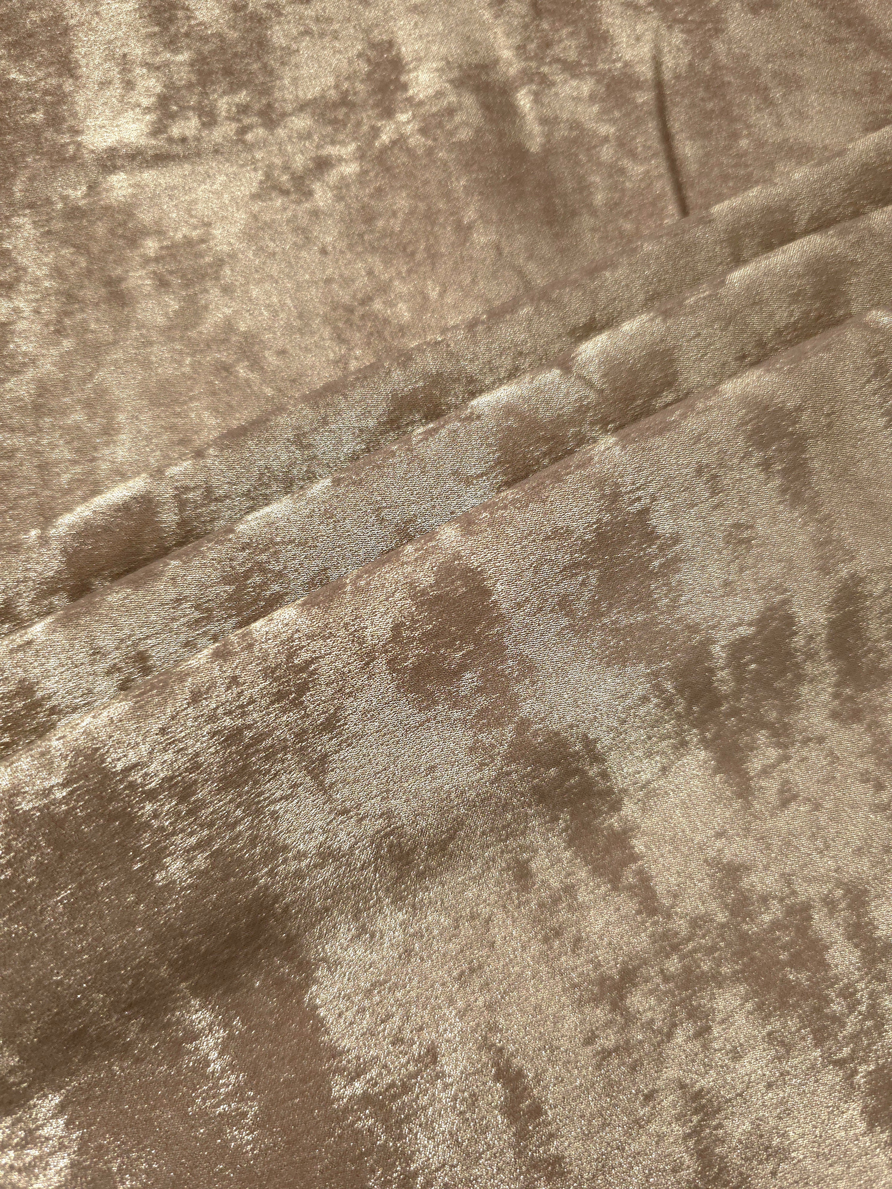 Platinum Beige Lurex Italiano metallic fabric in a rosette drape with luminous shimmer
