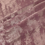 Rose Mauve Lurex Italiano fabric in diagonal folds showing metallic sheen and drape for eveningwear.