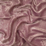Flowing folds of Rose Mauve Lurex Italiano fabric highlighting drape for abayas, kaftans and dresses.