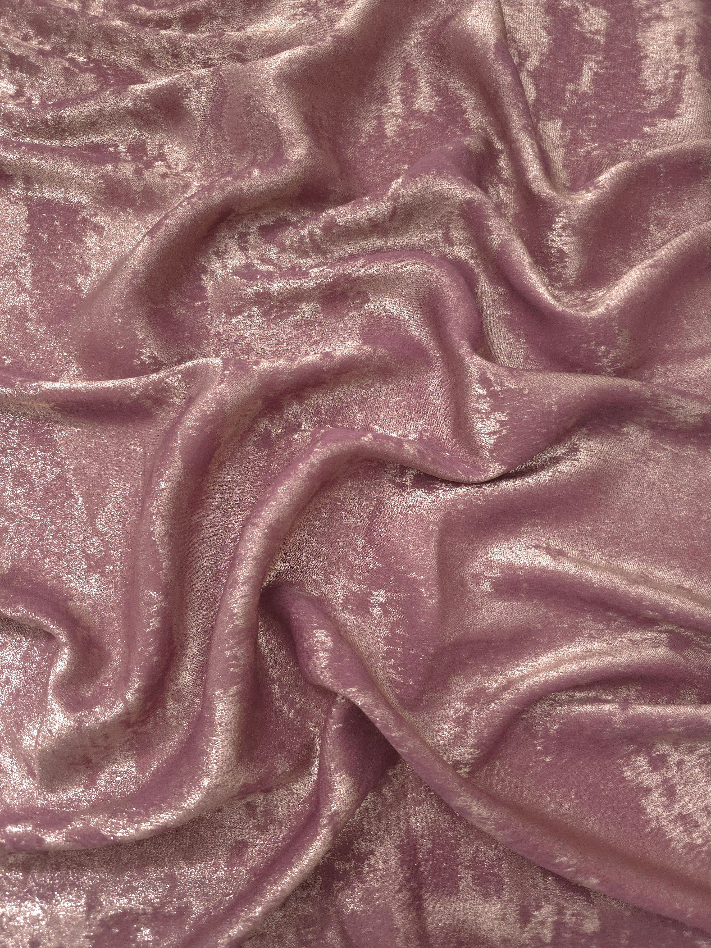 Flowing folds of Rose Mauve Lurex Italiano fabric highlighting drape for abayas, kaftans and dresses.
