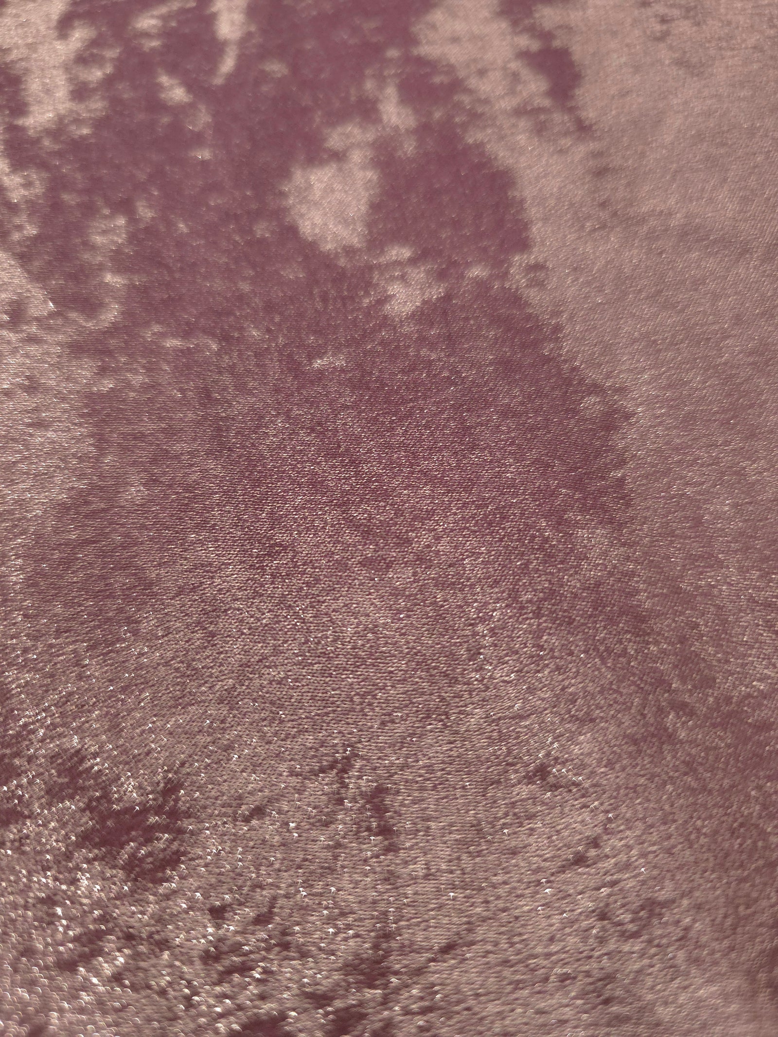 Macro close-up of Rose Mauve Lurex Italiano fabric revealing metallic texture for designer apparel.