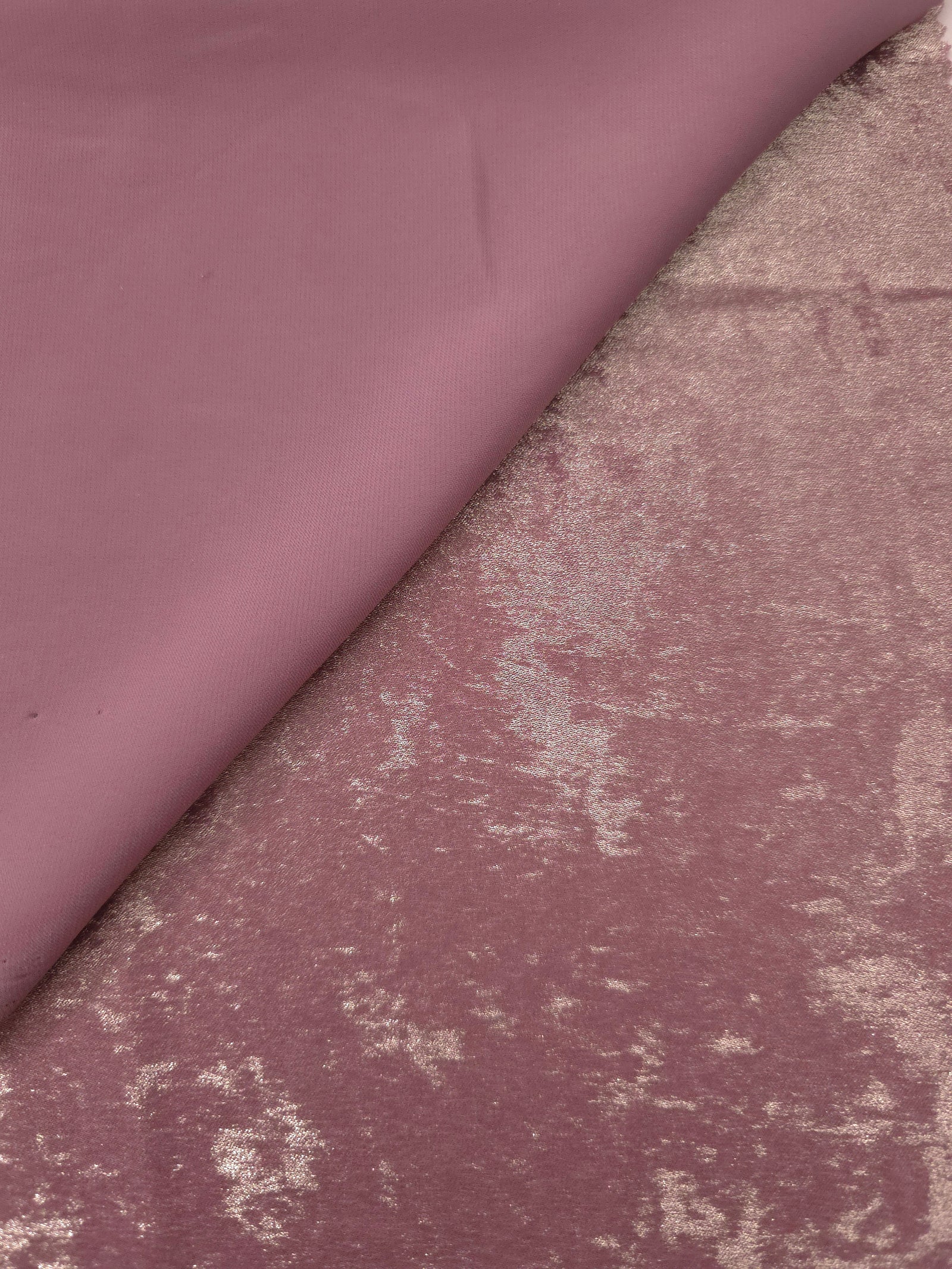 Reverse side of Rose Mauve Lurex Italiano fabric showing the backing and metallic finish for garment production.