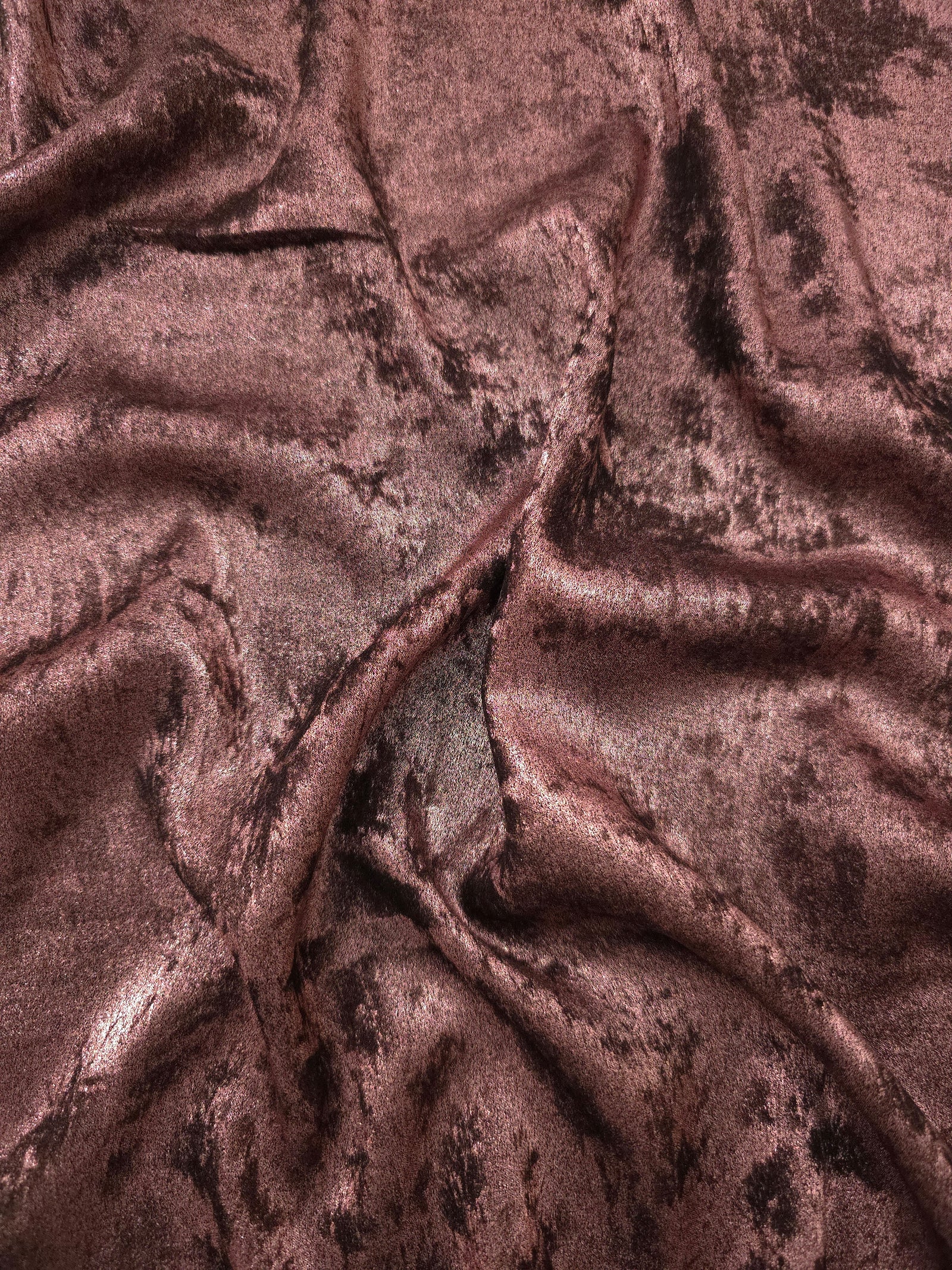 Flowing folds of Rosewood Lurex Italiano fabric highlighting drape for abayas, kaftans and dresses.