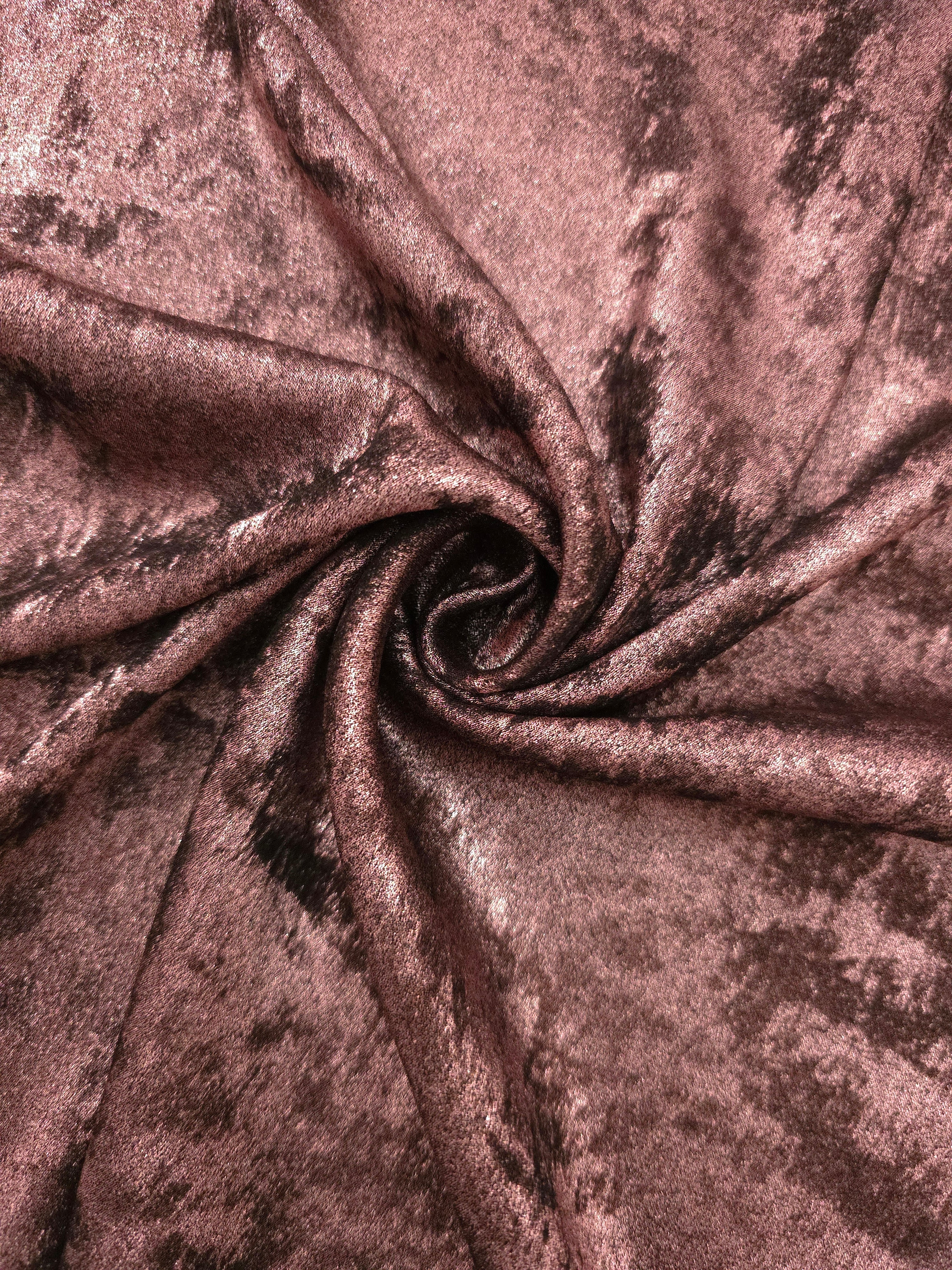 Rosette drape of Rosewood Lurex Italiano fabric emphasizing shimmer for kaftans and occasionwear.