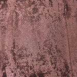 Macro close-up of Rosewood Lurex Italiano fabric revealing metallic texture for designer apparel.