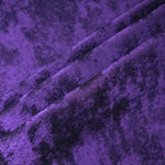 Royal Purple Lurex Italiano fabric in diagonal folds showing metallic sheen and drape for eveningwear.