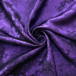 Rosette drape of Royal Purple Lurex Italiano fabric emphasizing shimmer for kaftans and occasionwear.