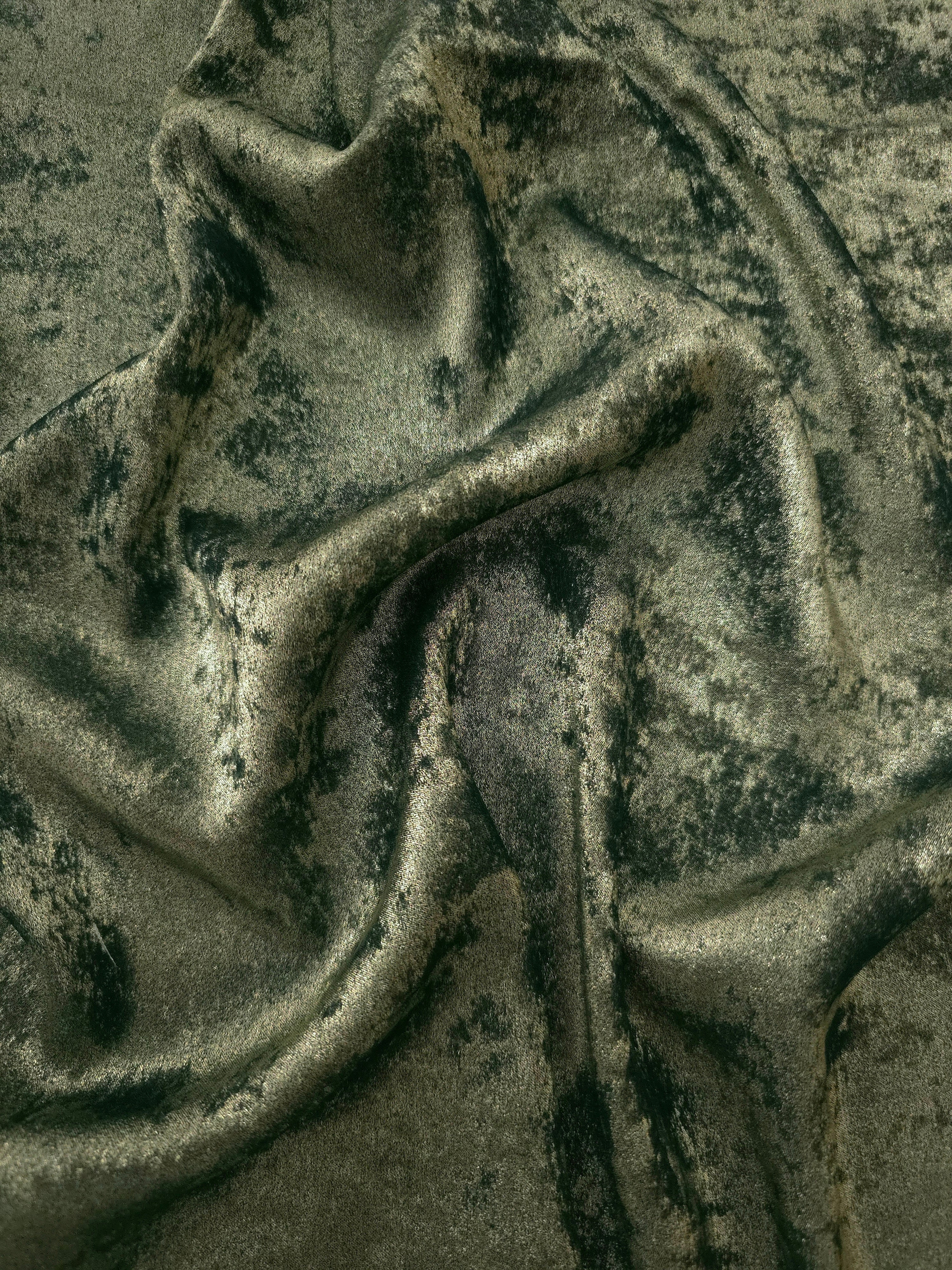 Flowing folds of Sage Olive Lurex Italiano fabric highlighting drape for abayas, kaftans and dresses.