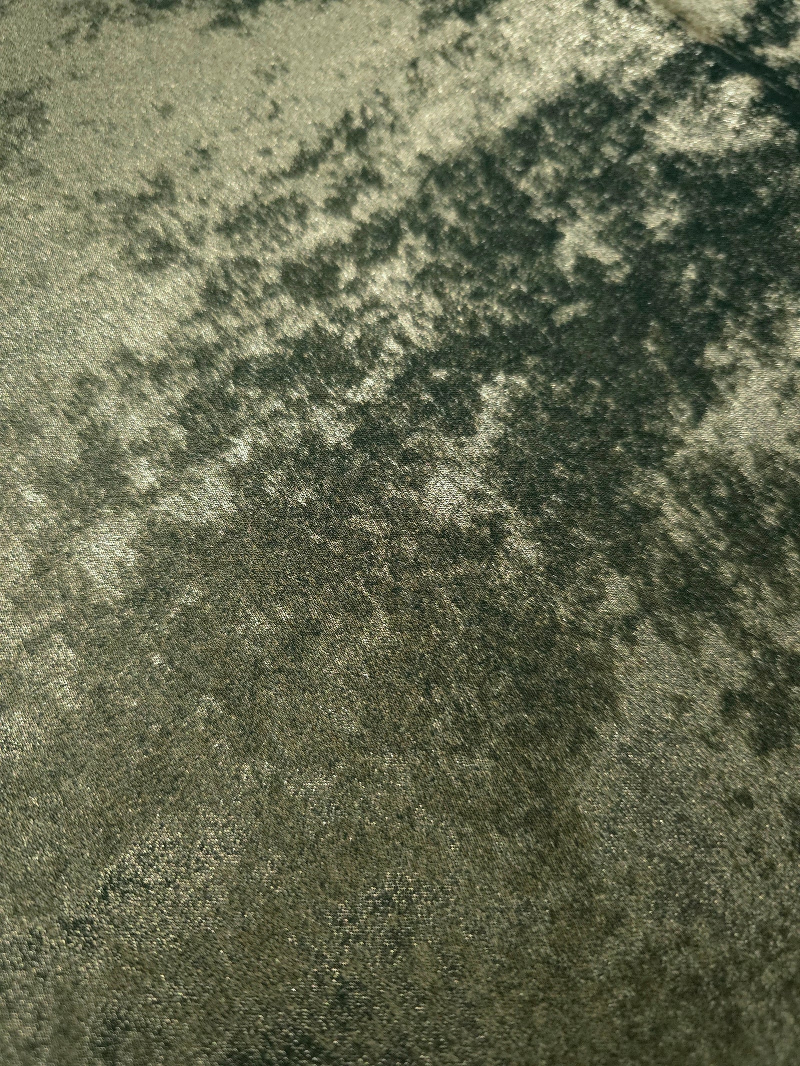 Macro close-up of Sage Olive Lurex Italiano fabric revealing metallic texture for designer apparel.