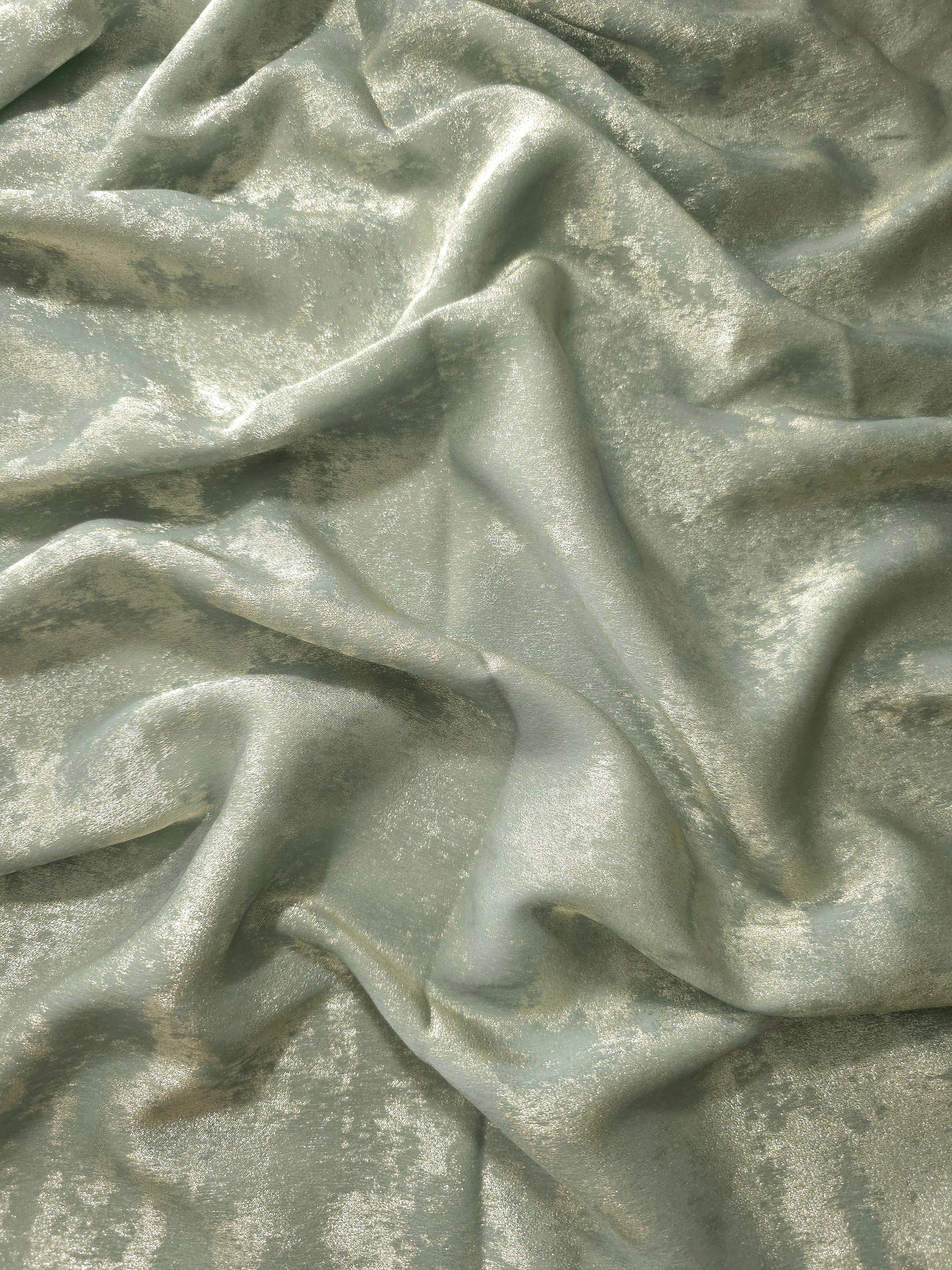 Fluid drape of Sage Silver Lurex Italiano metallic fabric for abayas and gowns