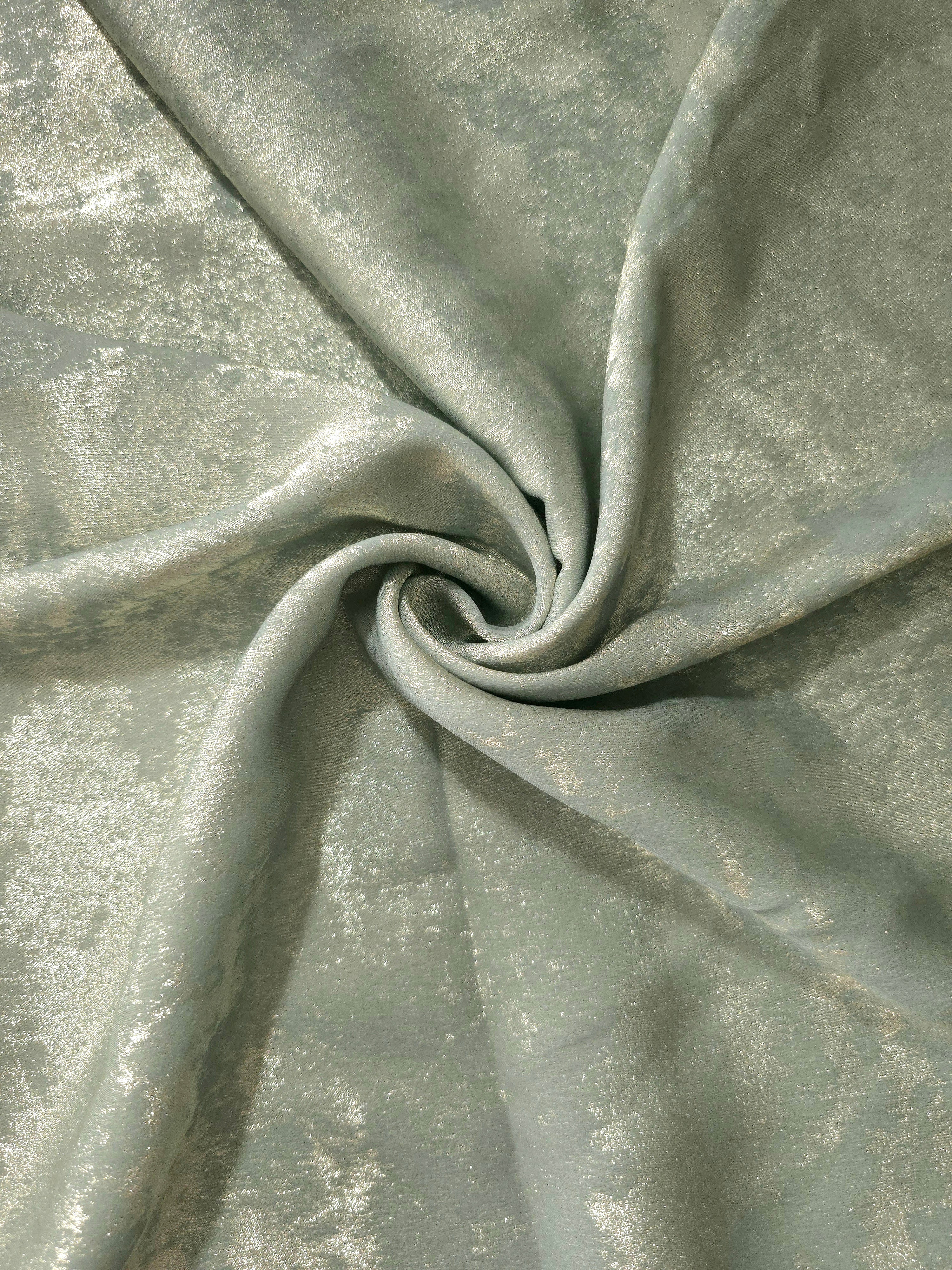 Sage Silver Lurex Italiano metallic fabric in a rosette drape with reflective shimmer