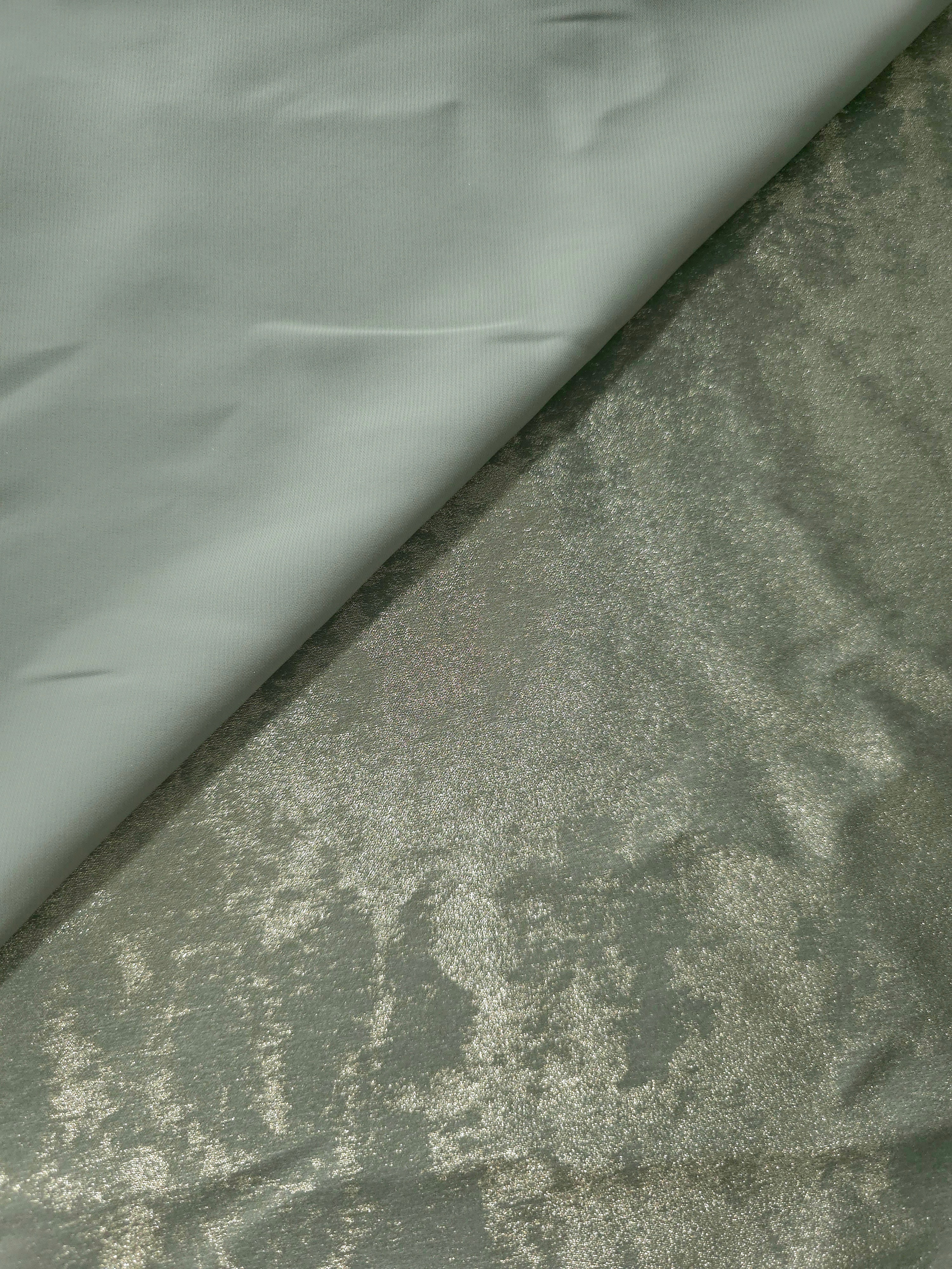 Reverse side of Sage Silver Lurex Italiano metallic fabric for apparel sewing