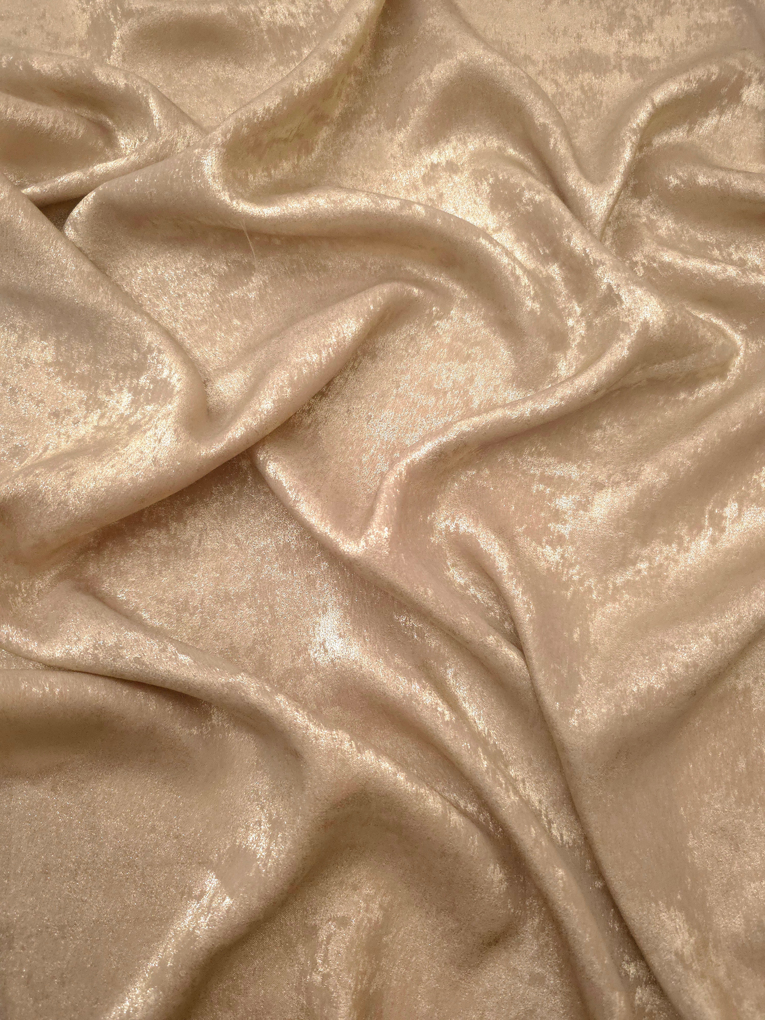 Fluid drape of Sand Gold Lurex Italiano metallic fabric for abayas and gowns