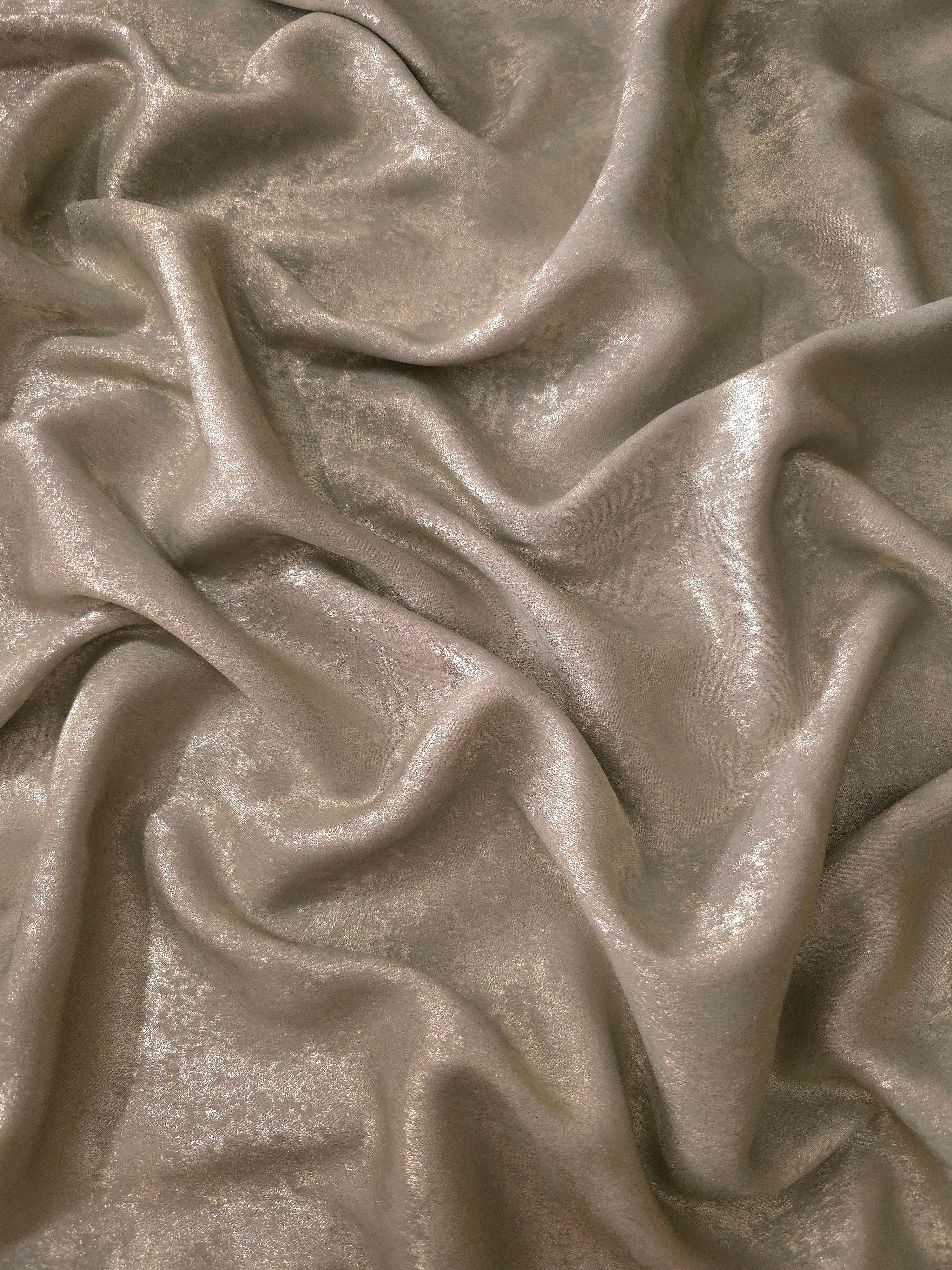 Fluid drape of Silver Greige Lurex Italiano metallic fabric for abayas and gowns