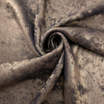 Smoky Taupe Lurex Italiano fabric in diagonal folds showing metallic sheen and drape for eveningwear.
