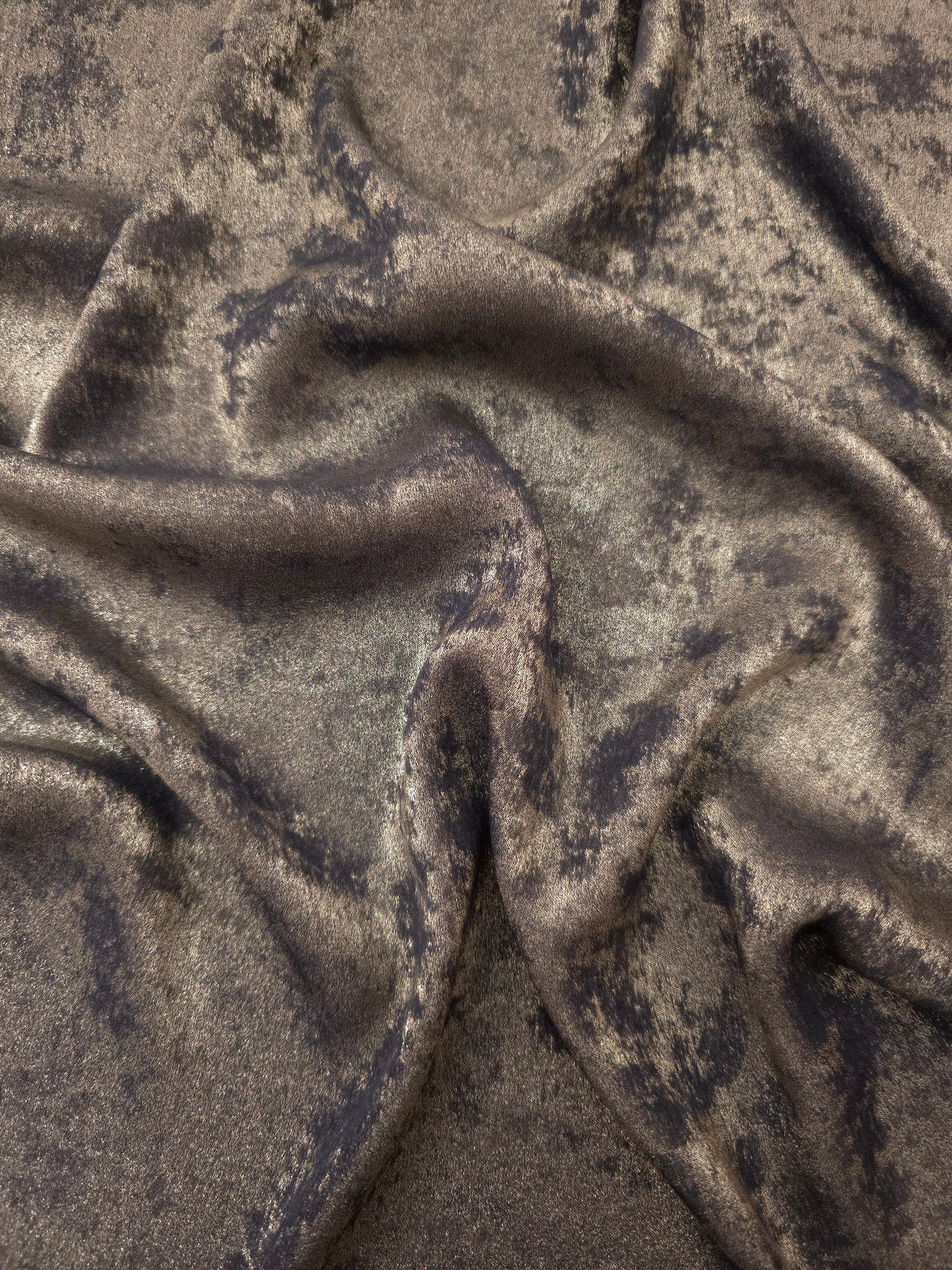 Flowing folds of Smoky Taupe Lurex Italiano fabric highlighting drape for abayas, kaftans and dresses.