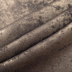 Rosette drape of Smoky Taupe Lurex Italiano fabric emphasizing shimmer for kaftans and occasionwear.