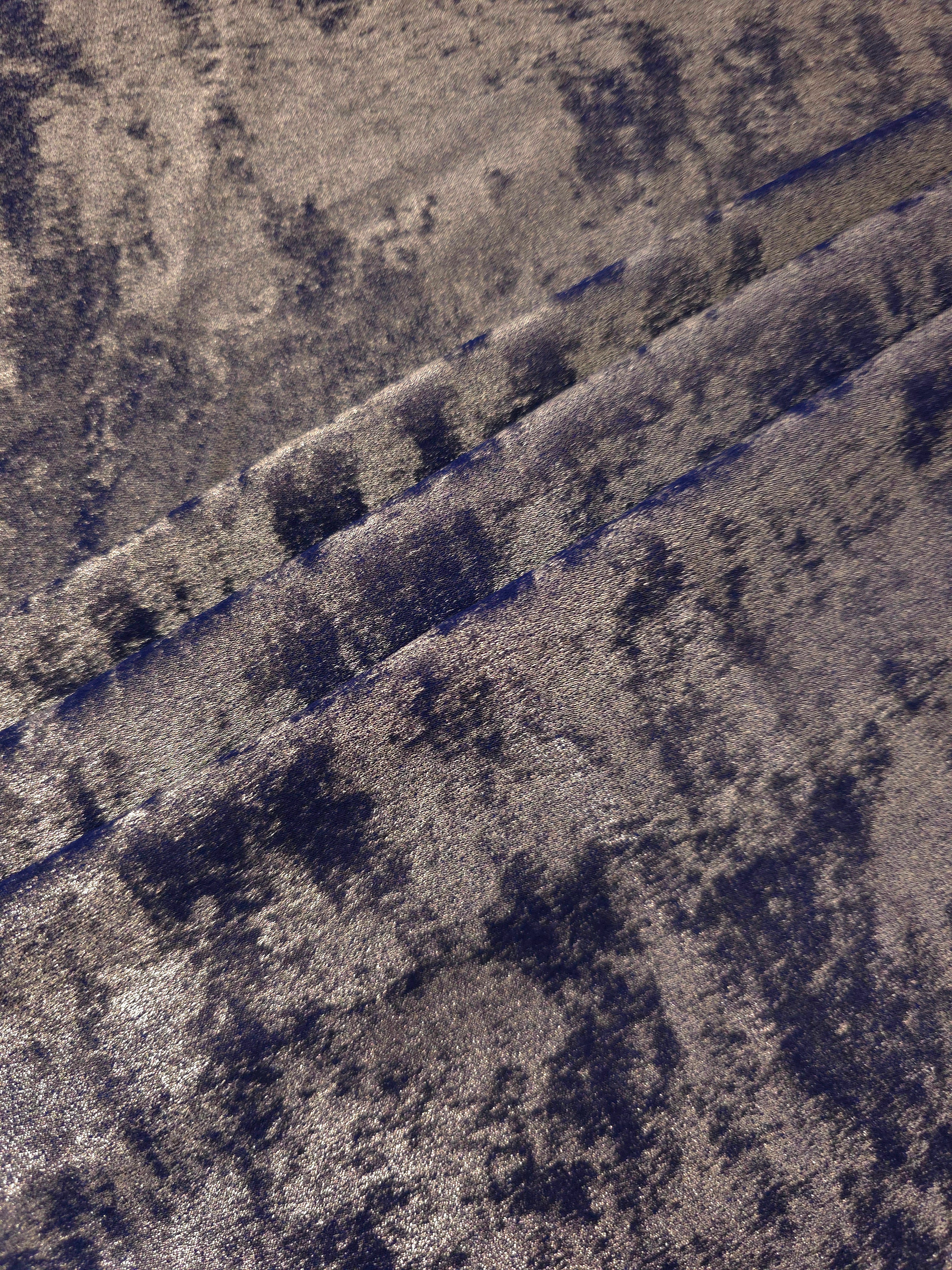 Smoky Violet Lurex Italiano fabric in diagonal folds showing metallic sheen and drape for eveningwear.