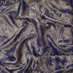 Rosette drape of Smoky Violet Lurex Italiano fabric emphasizing shimmer for kaftans and occasionwear.