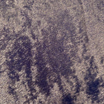 Macro close-up of Smoky Violet Lurex Italiano fabric revealing metallic texture for designer apparel.