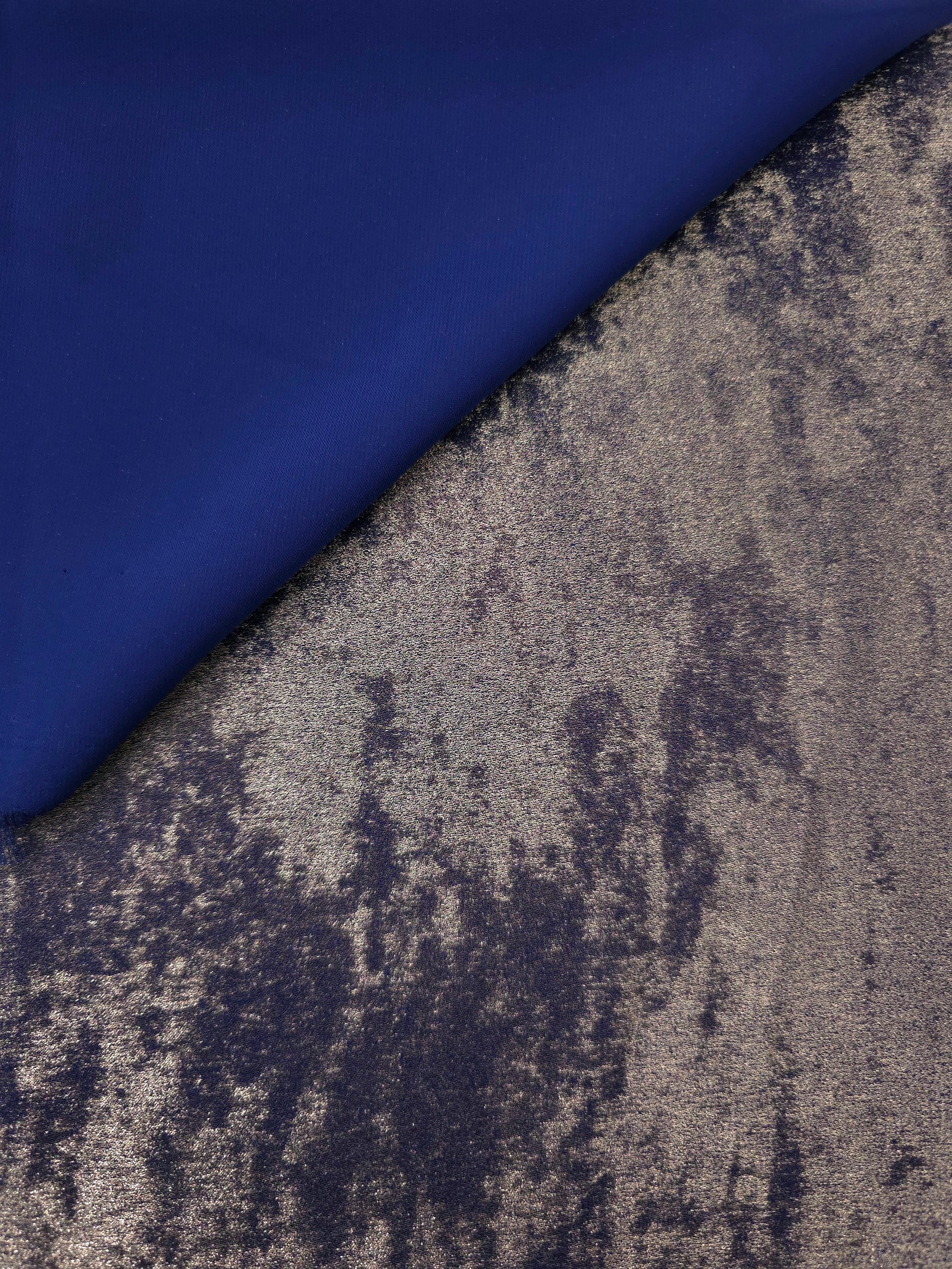 Reverse side of Smoky Violet Lurex Italiano fabric showing the backing and metallic finish for garment production.