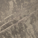 Stone Greige Lurex Italiano fabric in diagonal folds showing metallic sheen and drape for eveningwear.