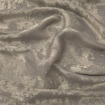 Flowing folds of Stone Greige Lurex Italiano fabric highlighting drape for abayas, kaftans and dresses.