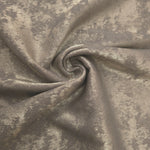 Rosette drape of Stone Greige Lurex Italiano fabric emphasizing shimmer for kaftans and occasionwear.