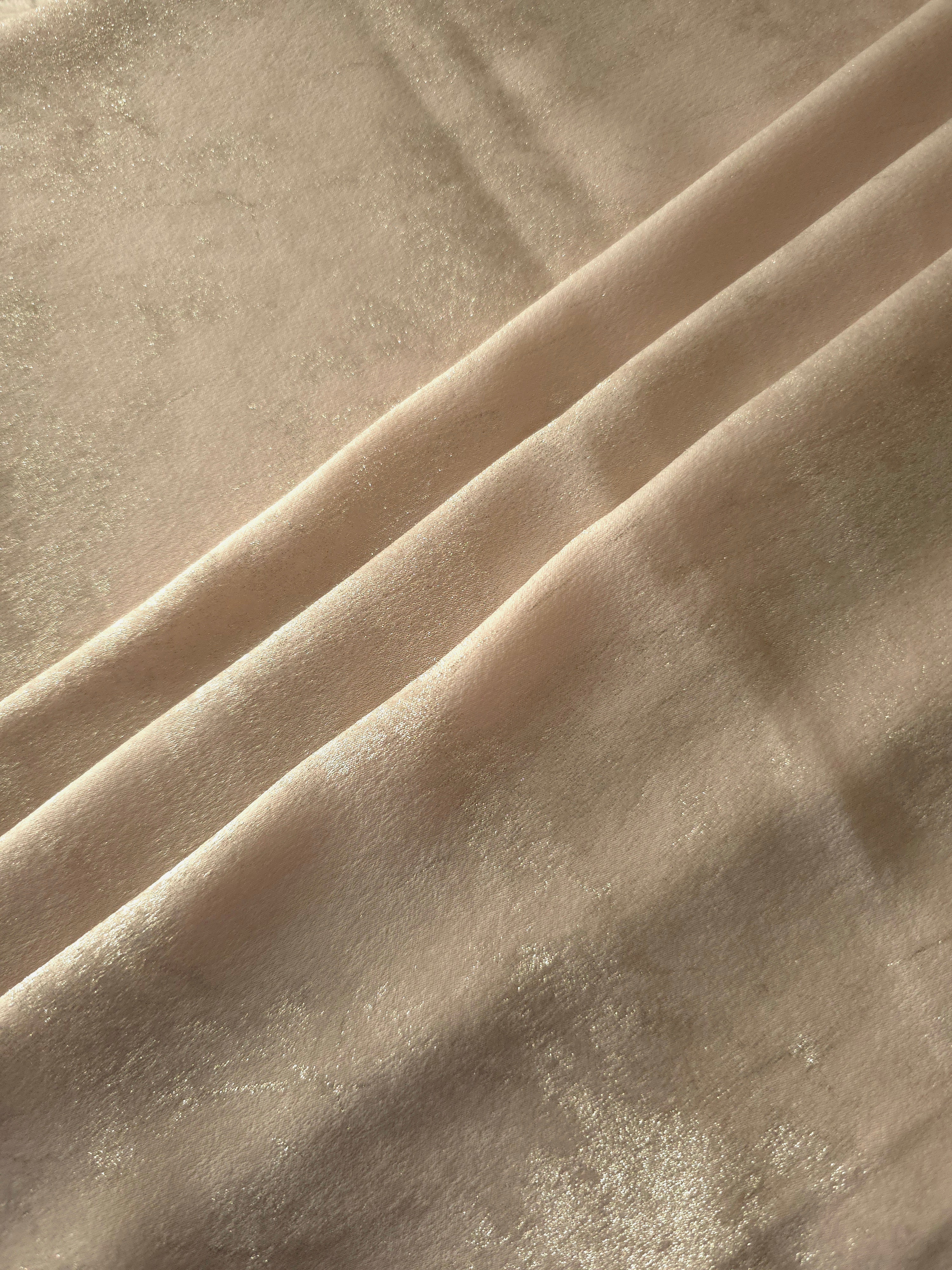 Vanilla Champagne Lurex Italiano metallic fabric arranged in diagonal eveningwear folds
