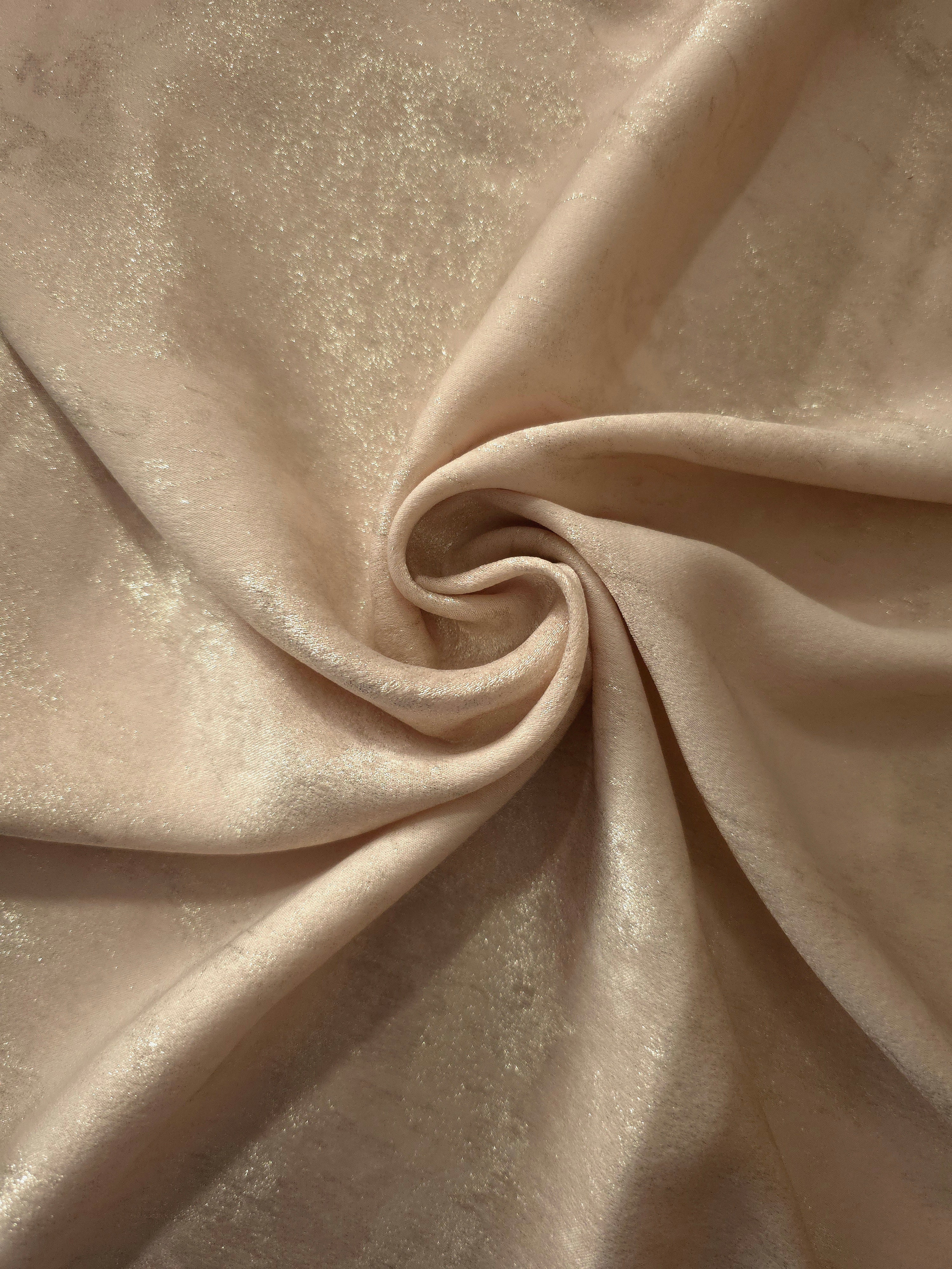 Vanilla Champagne Lurex Italiano metallic fabric in a luminous rosette drape
