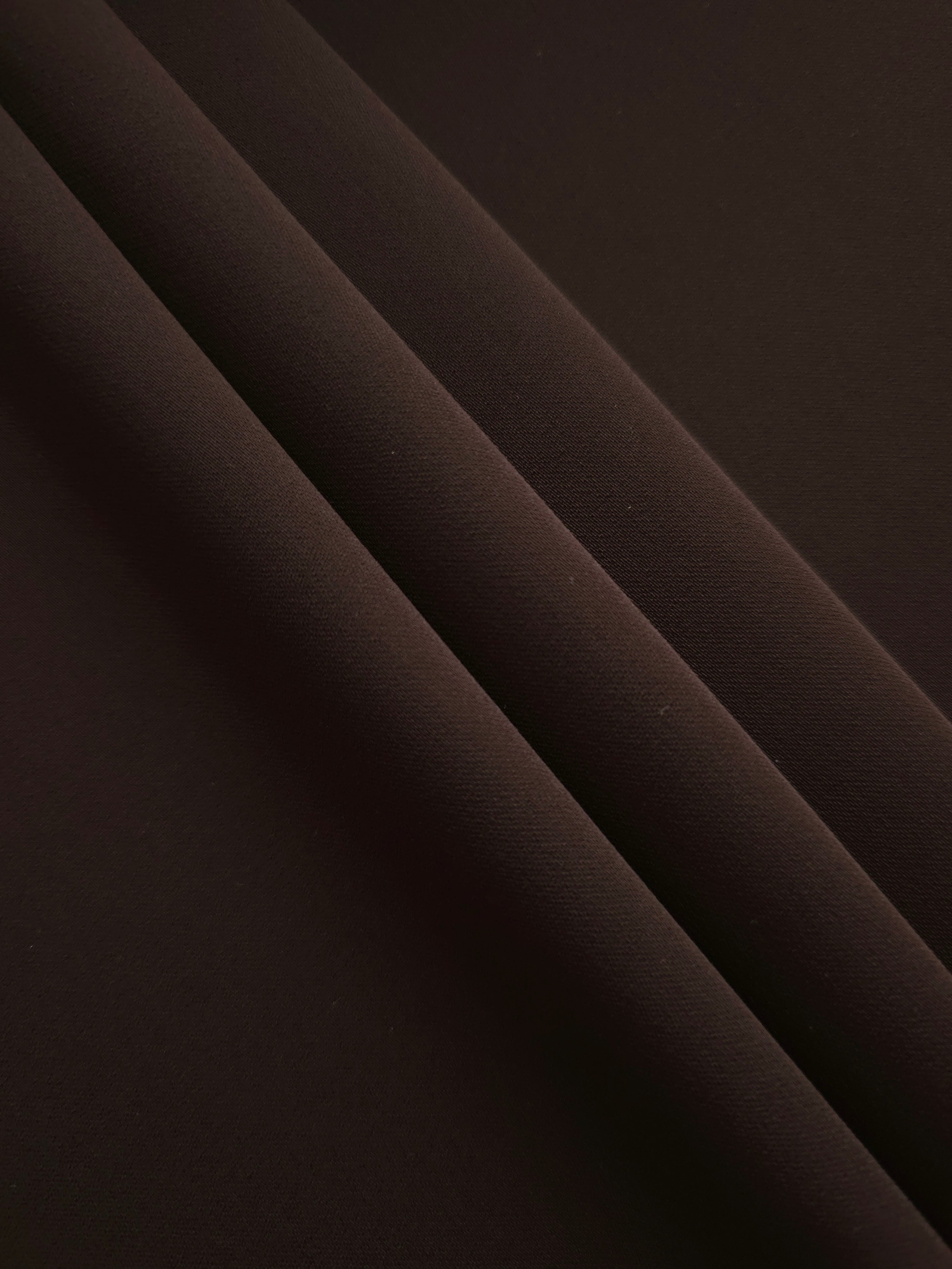 Layered Black Cocoa Silky Italian Crepe showing soft structure in layered folds, suitable for maxi dresses, modest sets and lightweight tailoring.