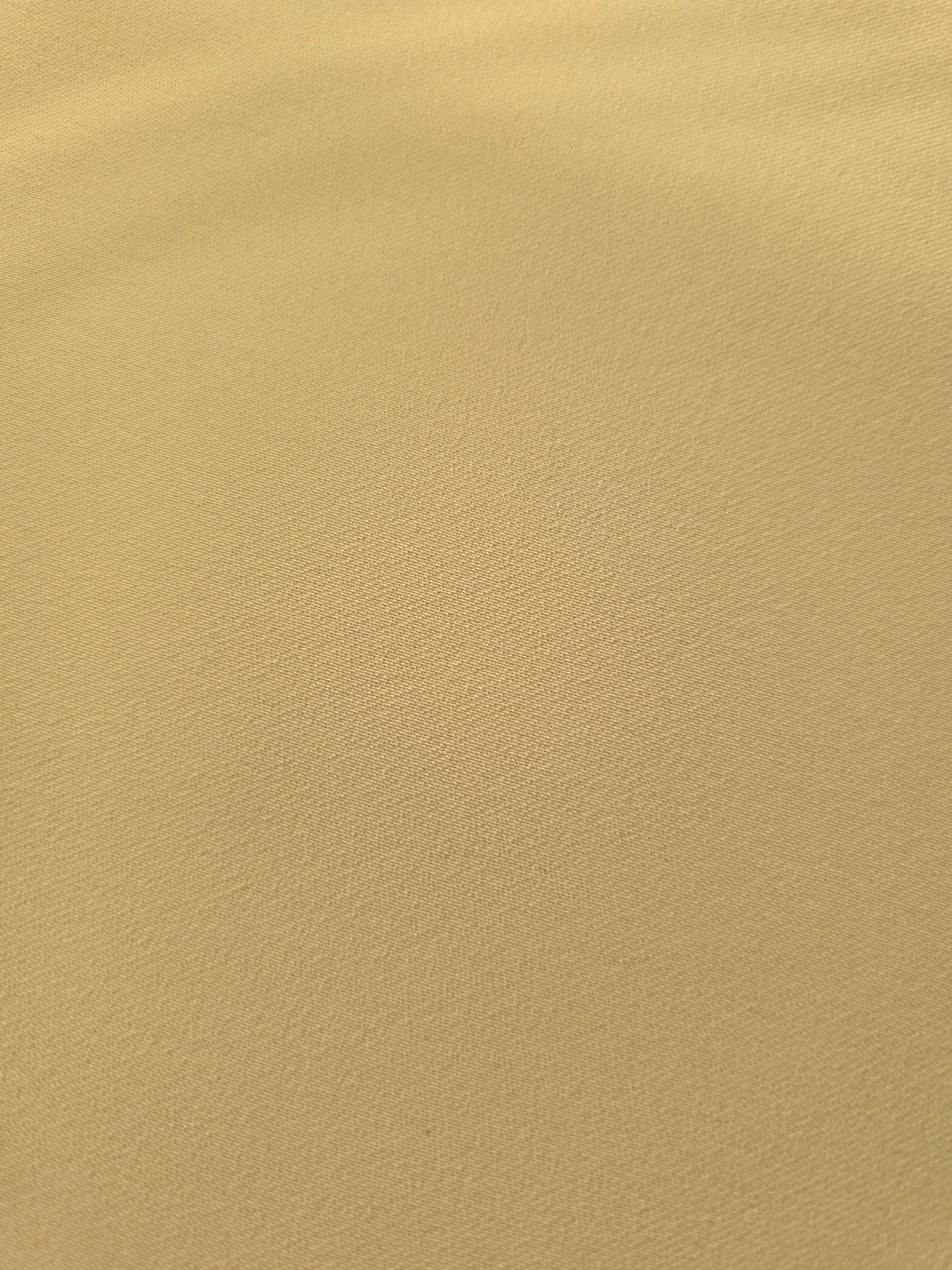 Close-up Buttercream Gold Silky Italian Crepe showing its fine woven texture and soft hand, ideal for wrap dresses, wide-leg trousers and dressy co-ords.