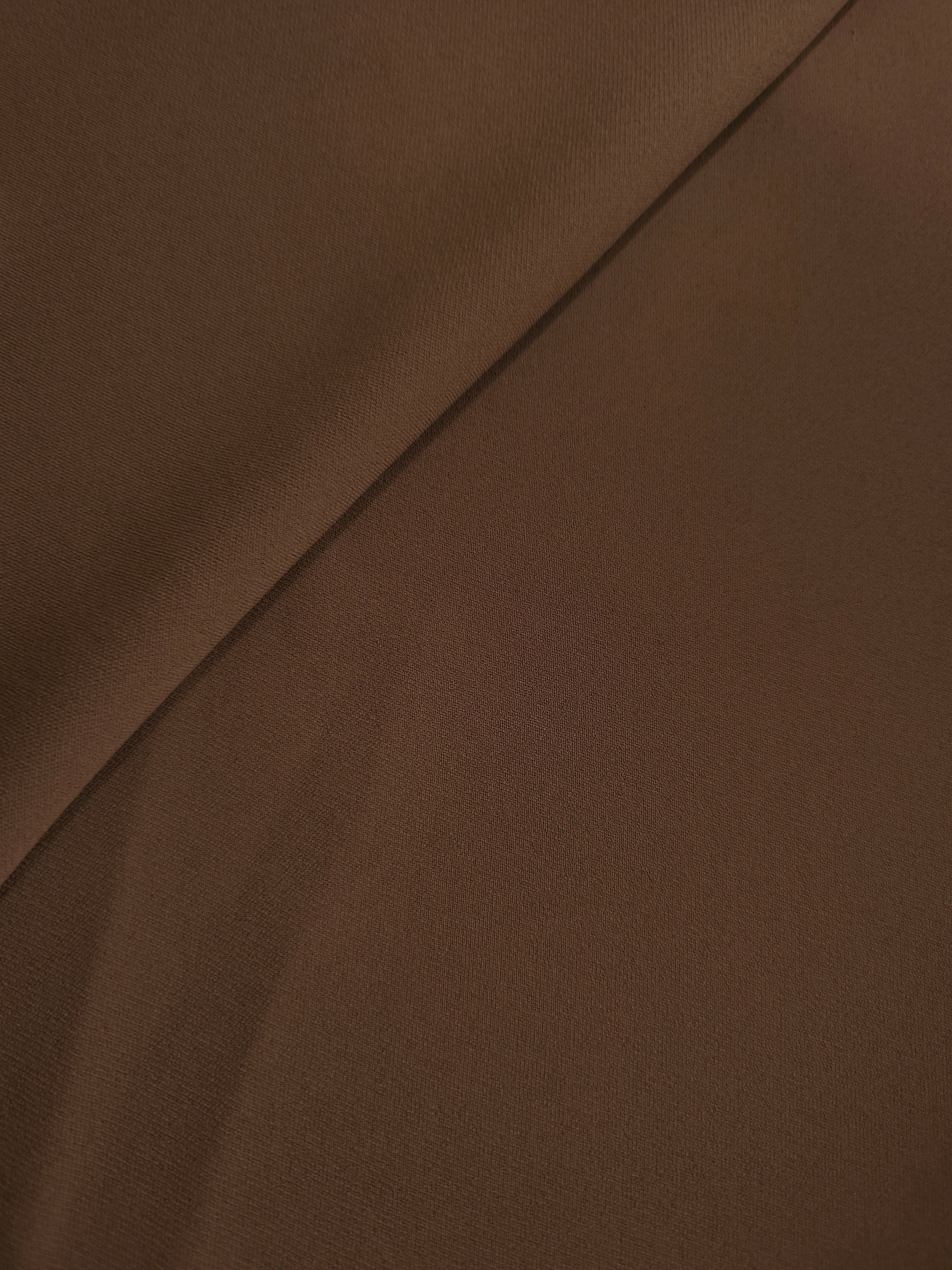 Soft-fold Cocoa Taupe Silky Italian Crepe showing fluid drape through soft folds, suited to formal gowns, abayas and special-occasion skirts.