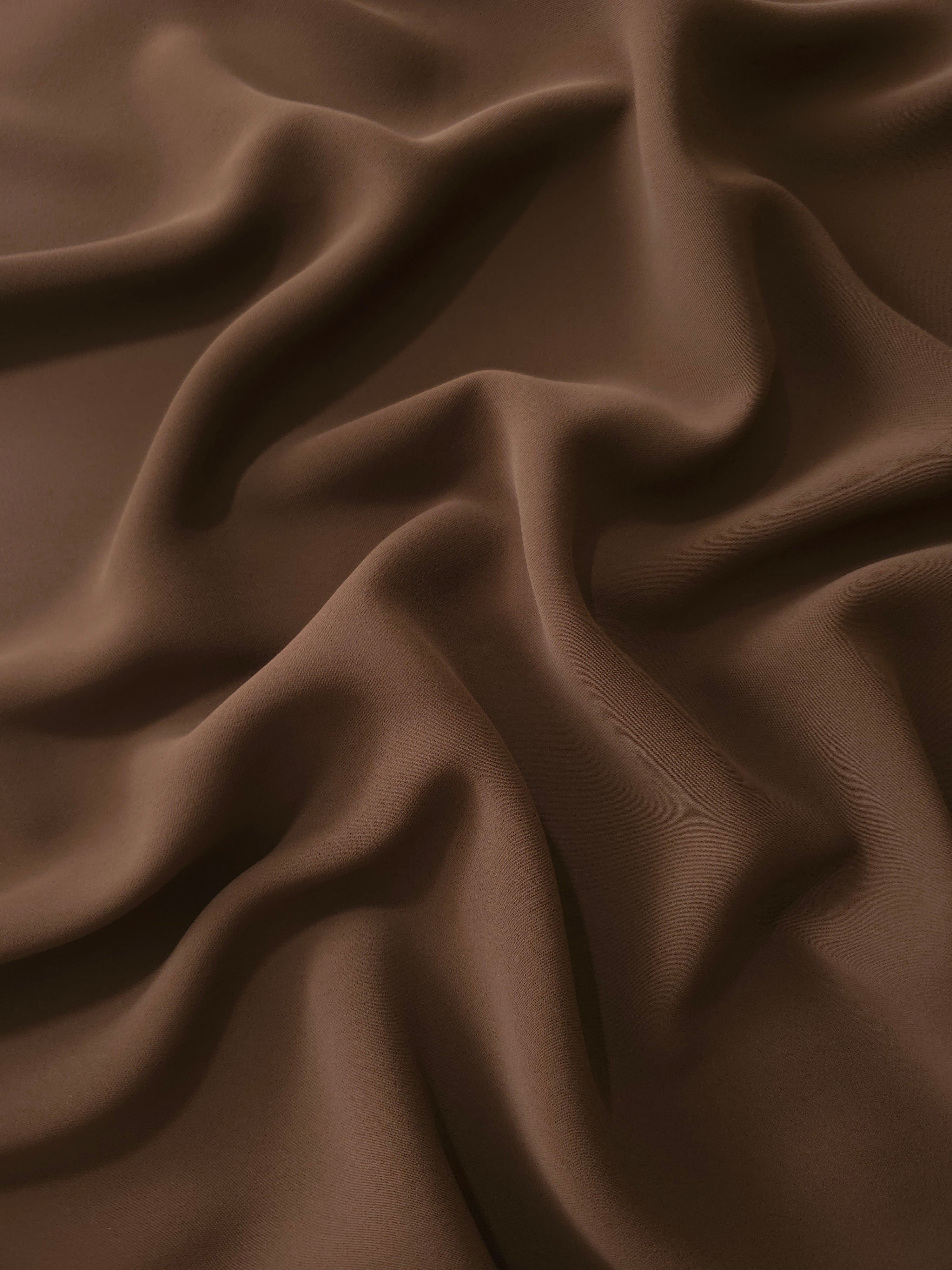 Draped Cocoa Taupe Silky Italian Crepe showing an elegant fall through draped folds, ideal for office blouses, tailored dresses and soft jackets.