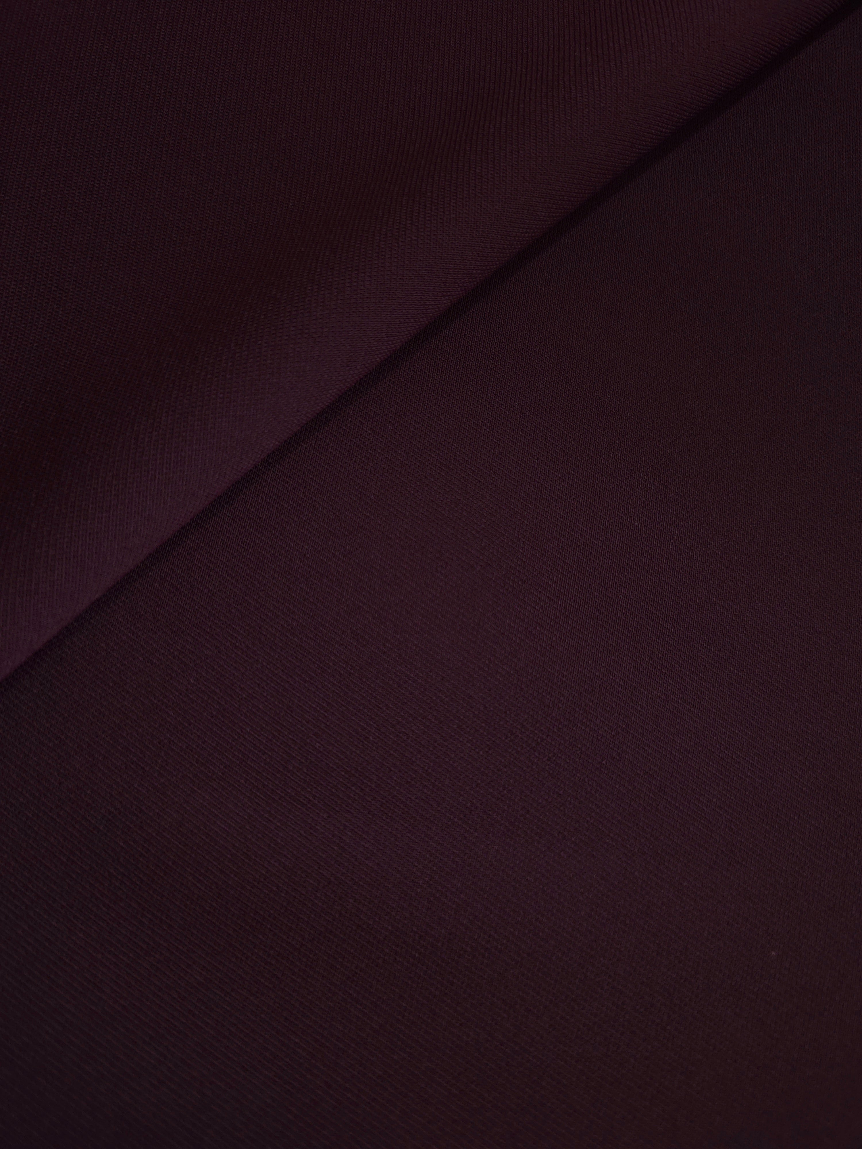 Soft-fold Damson Plum Silky Italian Crepe showing fluid drape through soft folds, suited to evening dresses, flowing skirts and occasionwear tops.