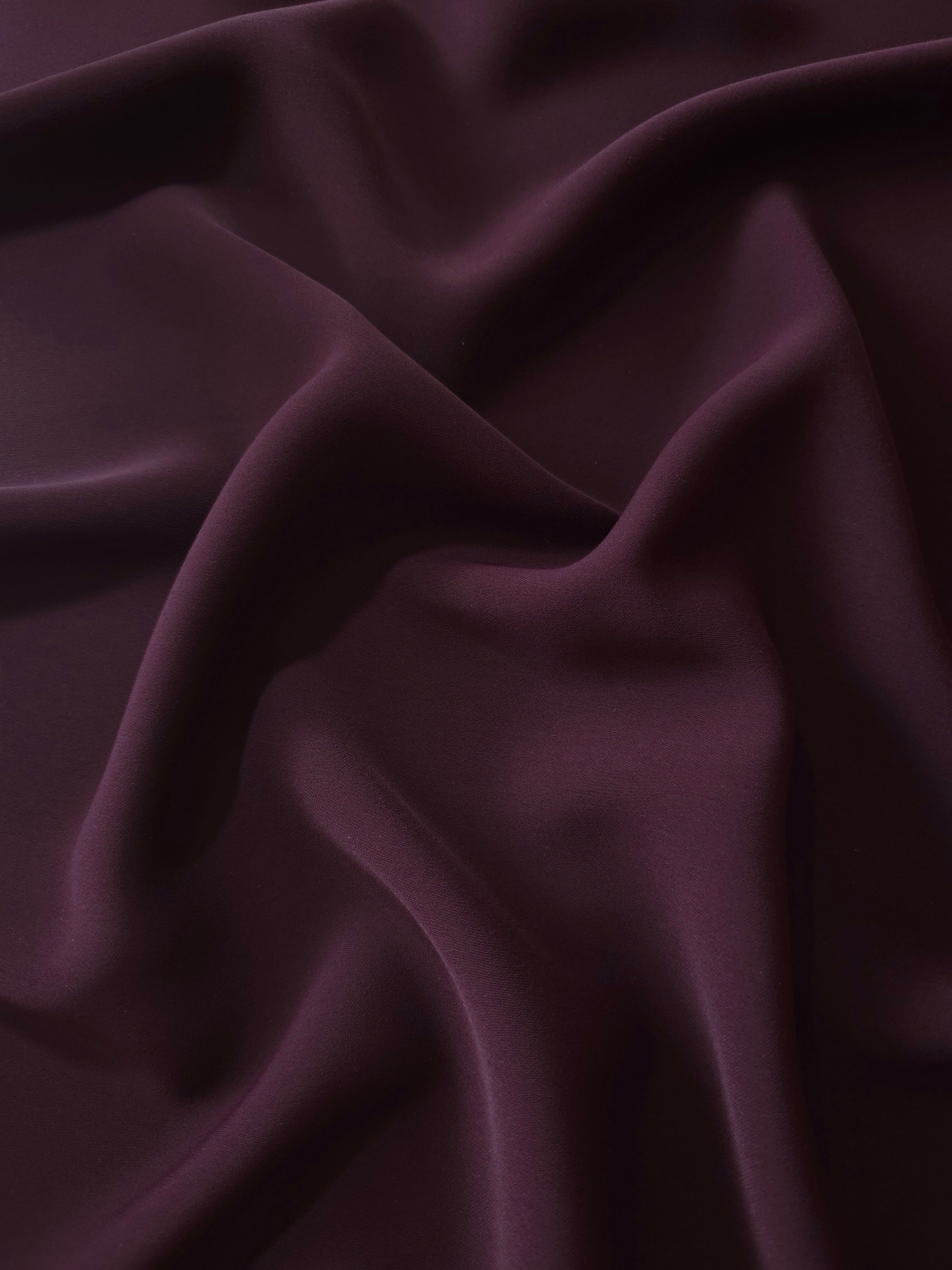 Draped Damson Plum Silky Italian Crepe showing an elegant fall through draped folds, ideal for maxi dresses, modest sets and lightweight tailoring.