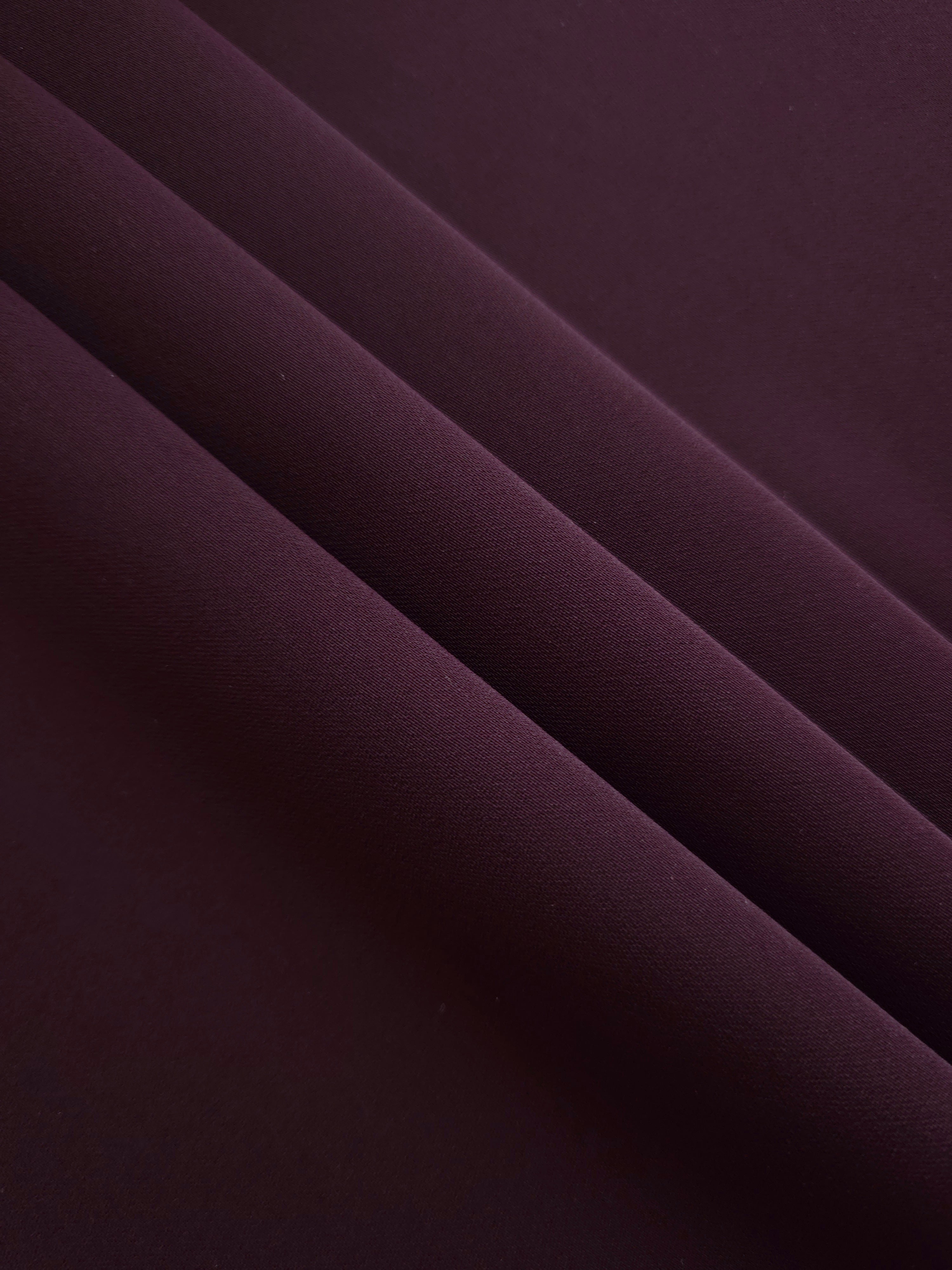Layered Damson Plum Silky Italian Crepe showing soft structure in layered folds, suitable for wrap dresses, wide-leg trousers and dressy co-ords.