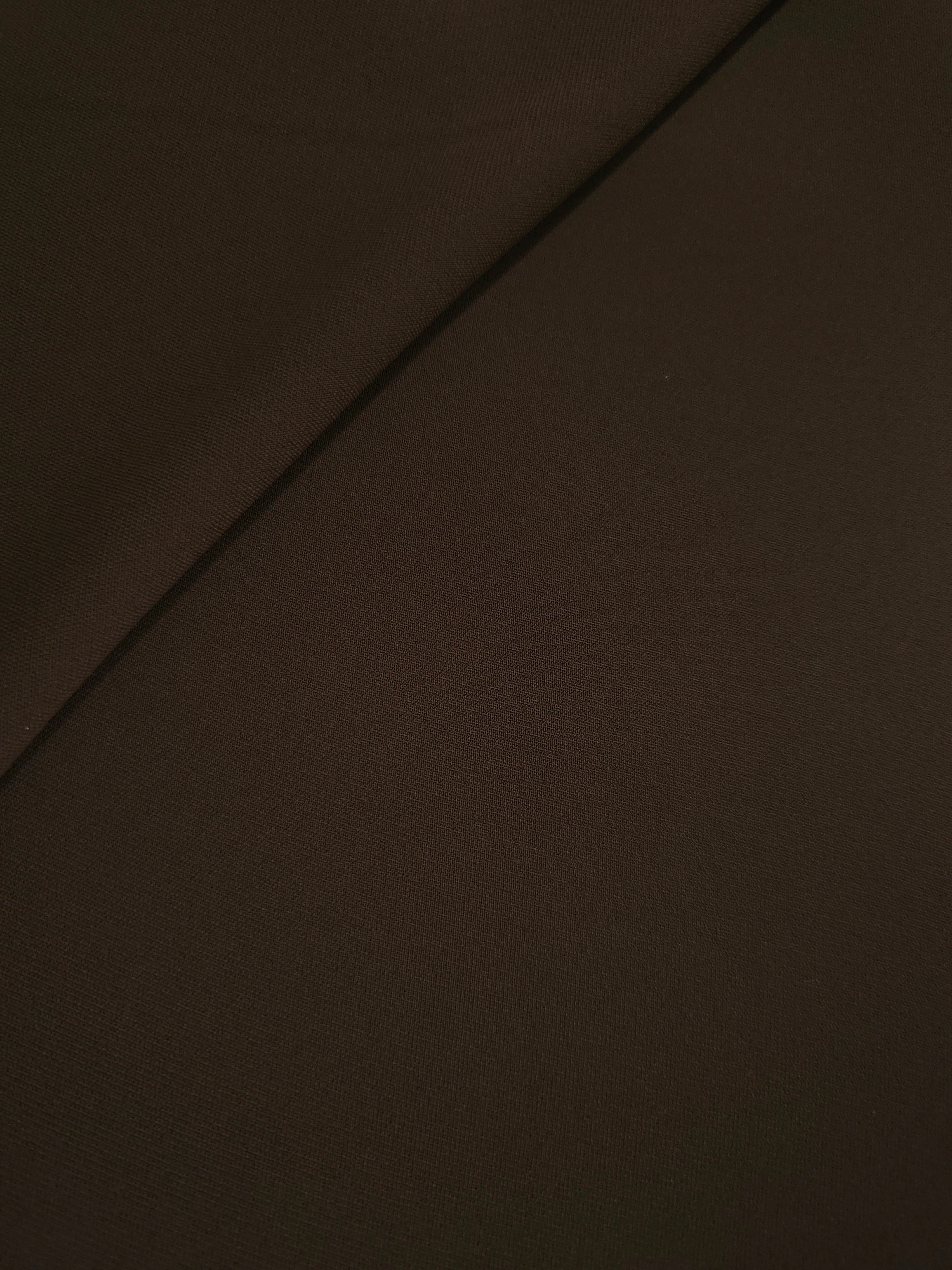 Soft-fold Deep Espresso Silky Italian Crepe showing fluid drape through soft folds, suited to cocktail dresses, skirts and polished separates.