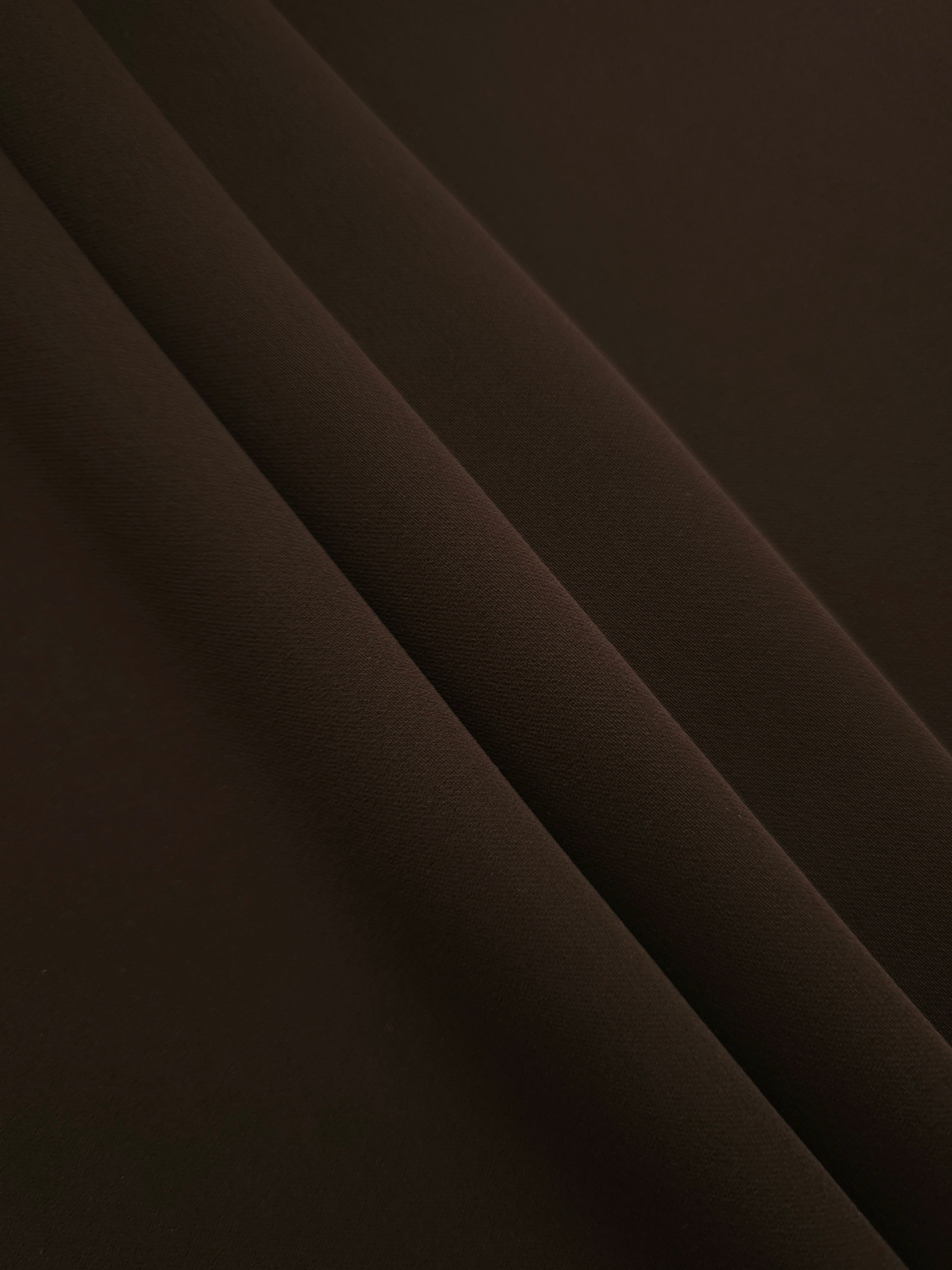 Layered Deep Espresso Silky Italian Crepe showing soft structure in layered folds, suitable for abayas, tunics and elegant shirt dresses.