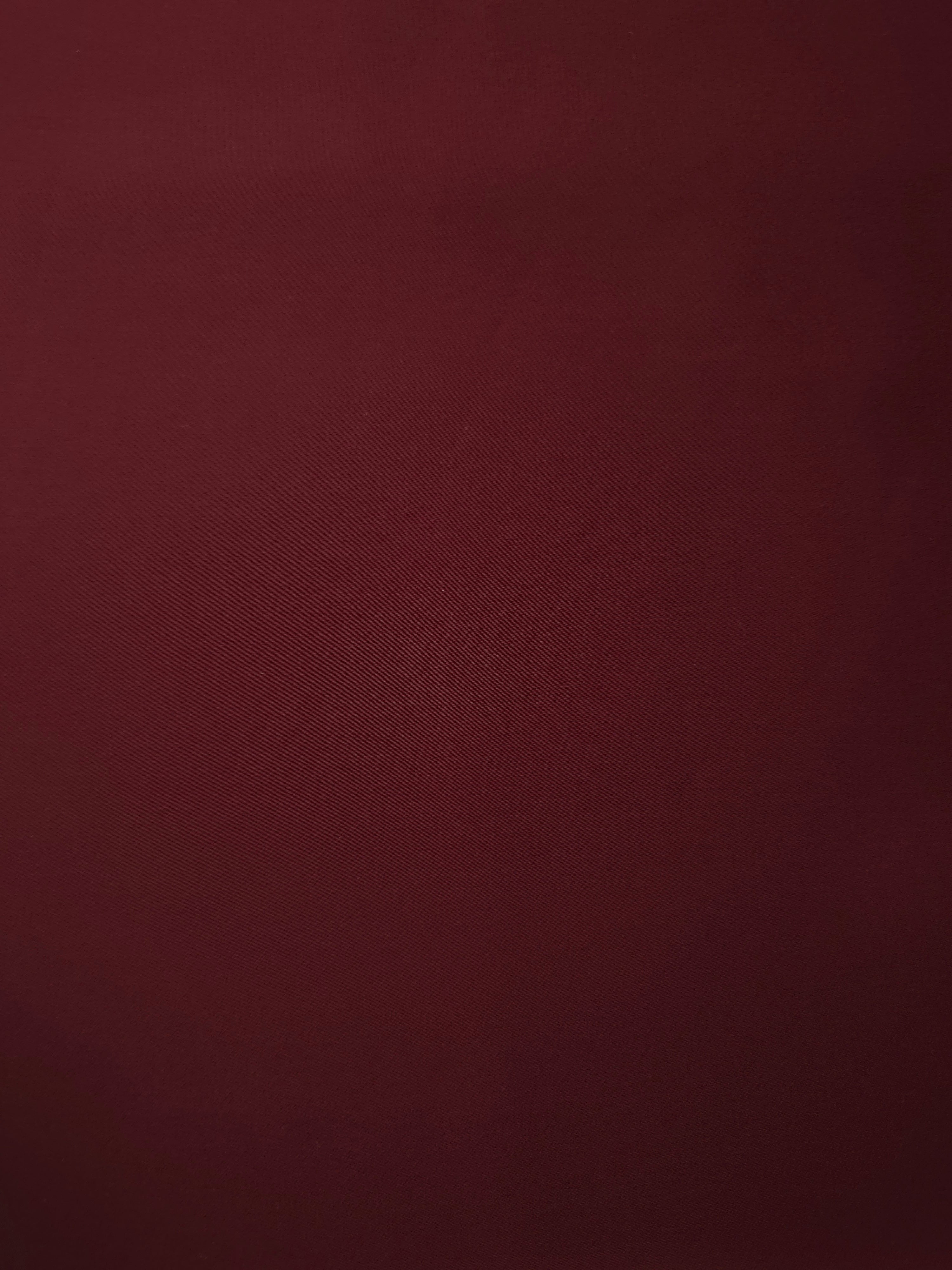 Garnet Wine Silky Italian Crepe with a smooth opaque finish, suitable for formal gowns, abayas and special-occasion skirts.