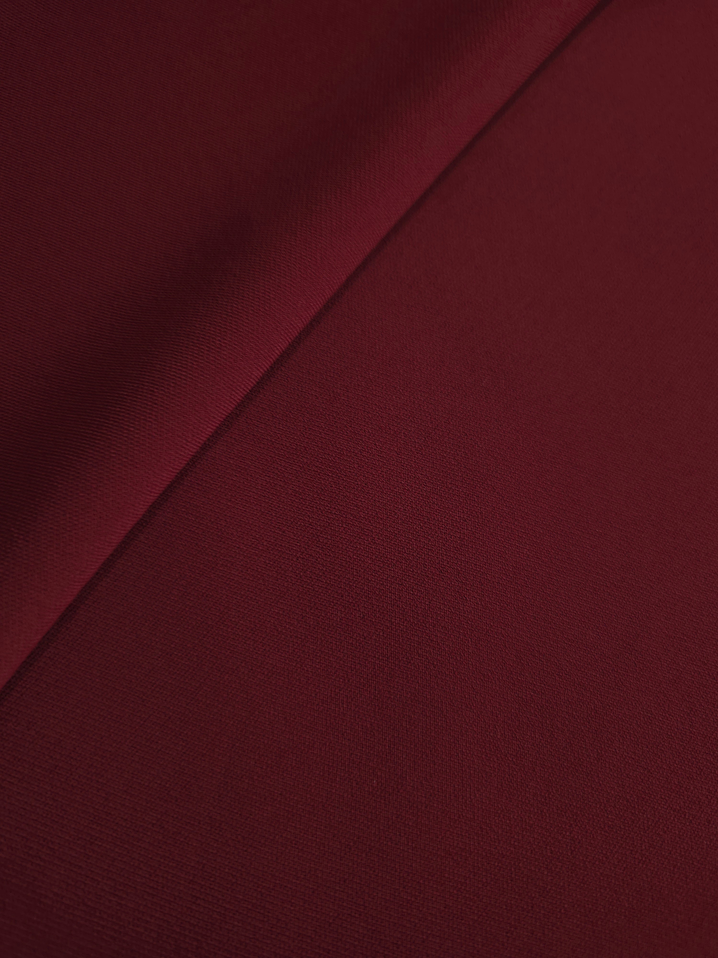 Soft-fold Garnet Wine Silky Italian Crepe showing fluid drape through soft folds, suited to kaftans, long skirts and fluid occasionwear.