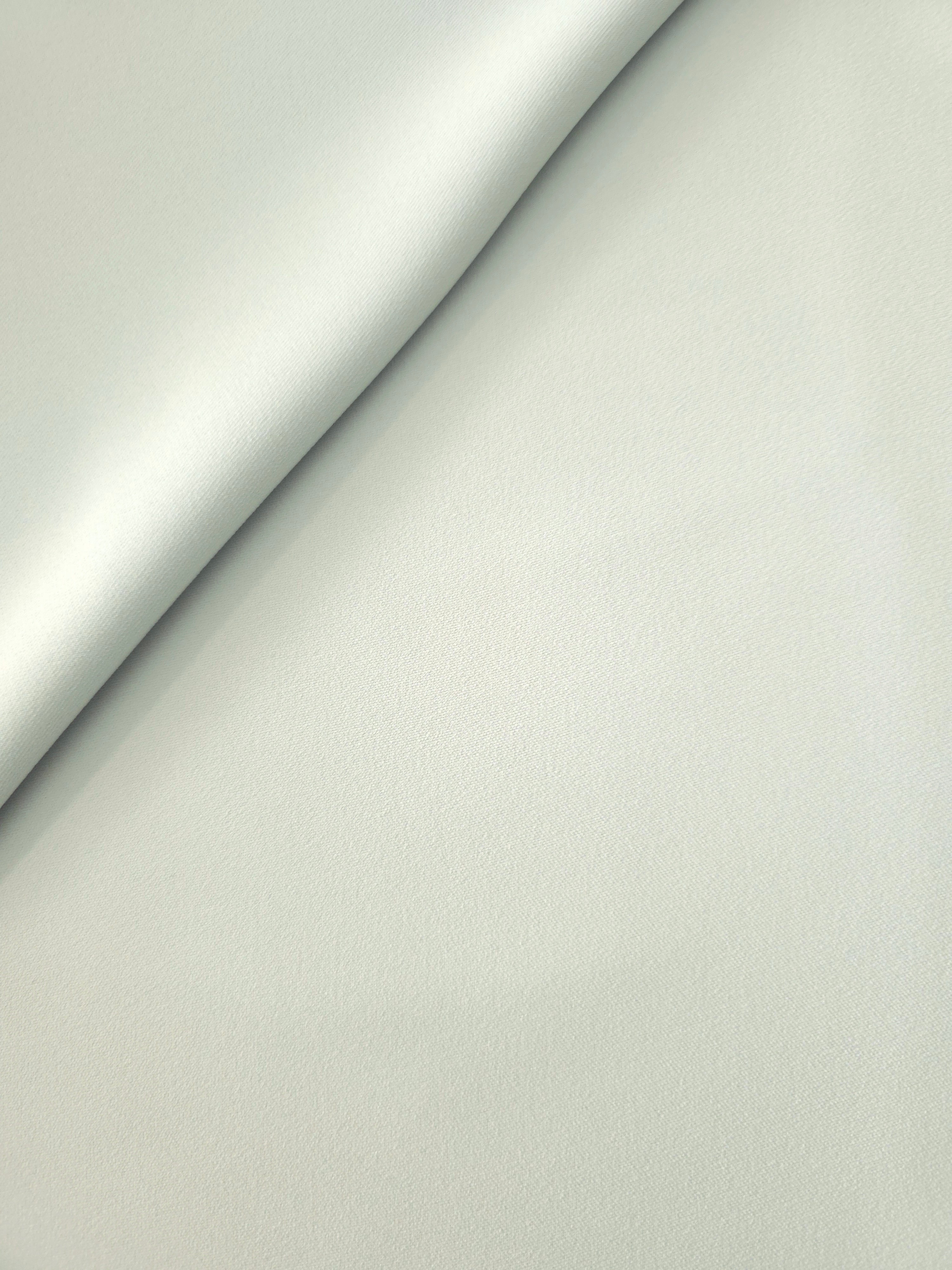 Soft-fold Glacial Mint Silky Italian Crepe showing fluid drape through soft folds, suited to evening dresses, flowing skirts and occasionwear tops.
