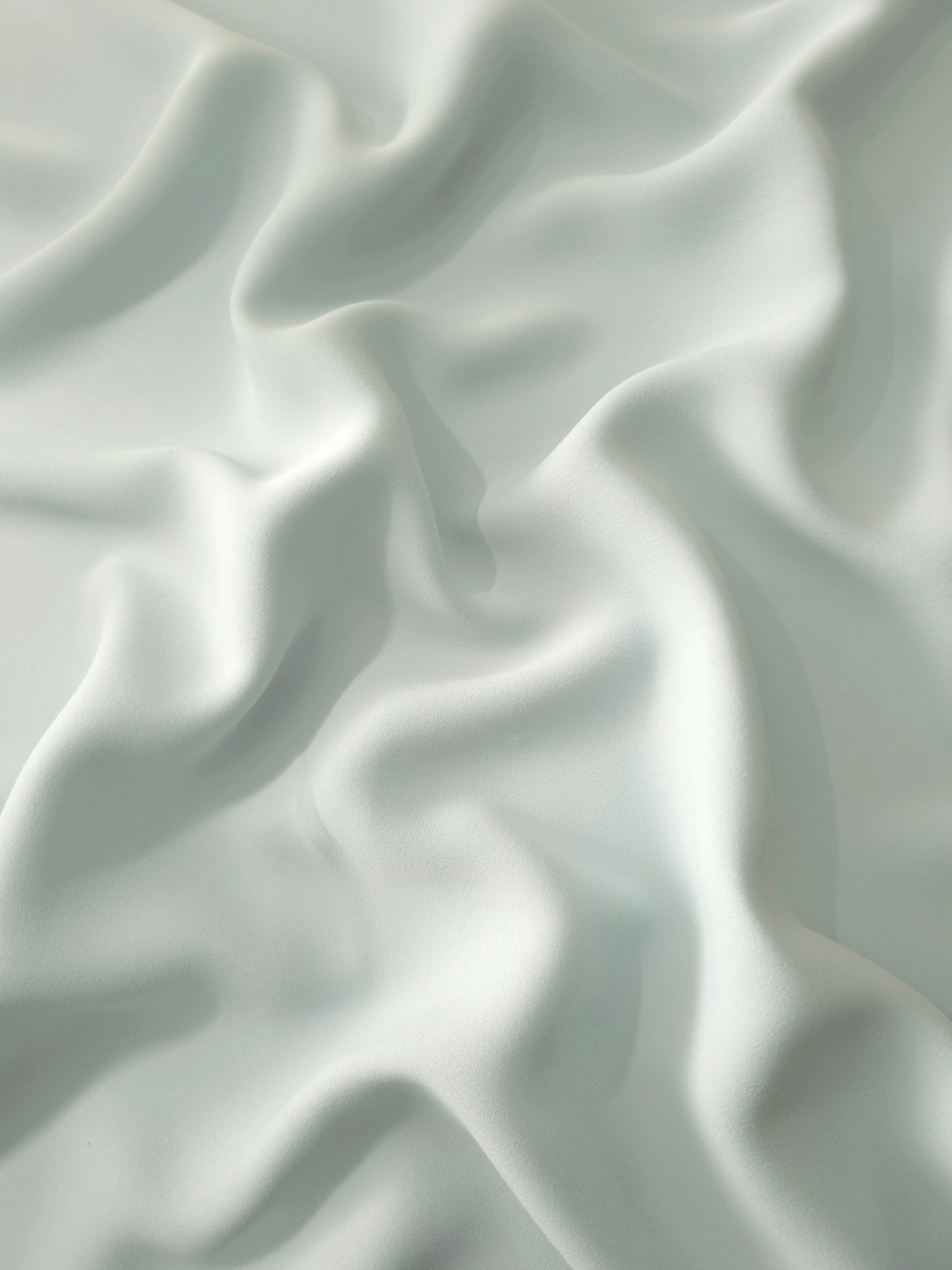 Draped Glacial Mint Silky Italian Crepe showing an elegant fall through draped folds, ideal for maxi dresses, modest sets and lightweight tailoring.