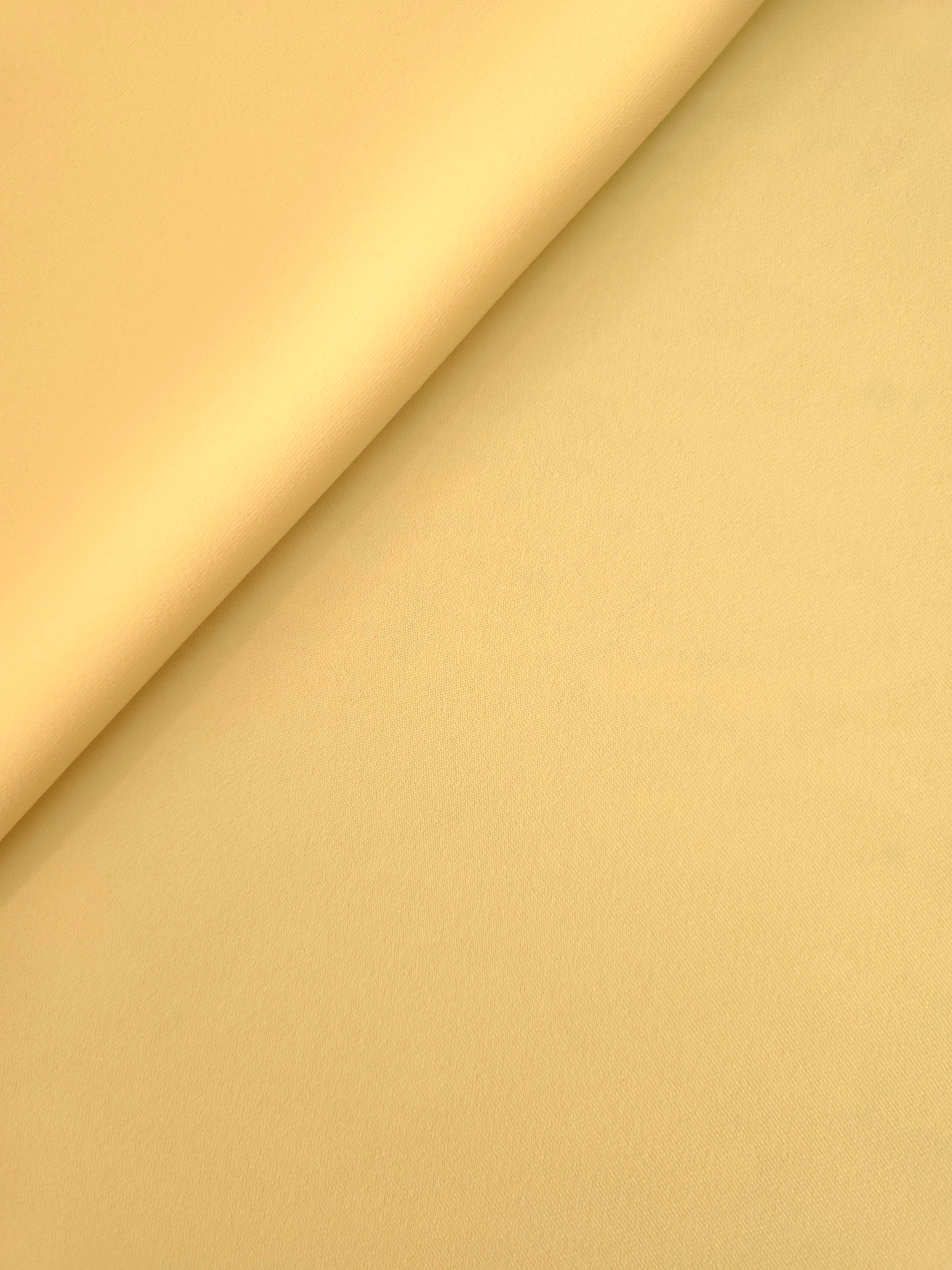 Soft-fold Honey Marigold Silky Italian Crepe showing fluid drape through soft folds, suited to bridesmaid dresses, blouses and refined separates.